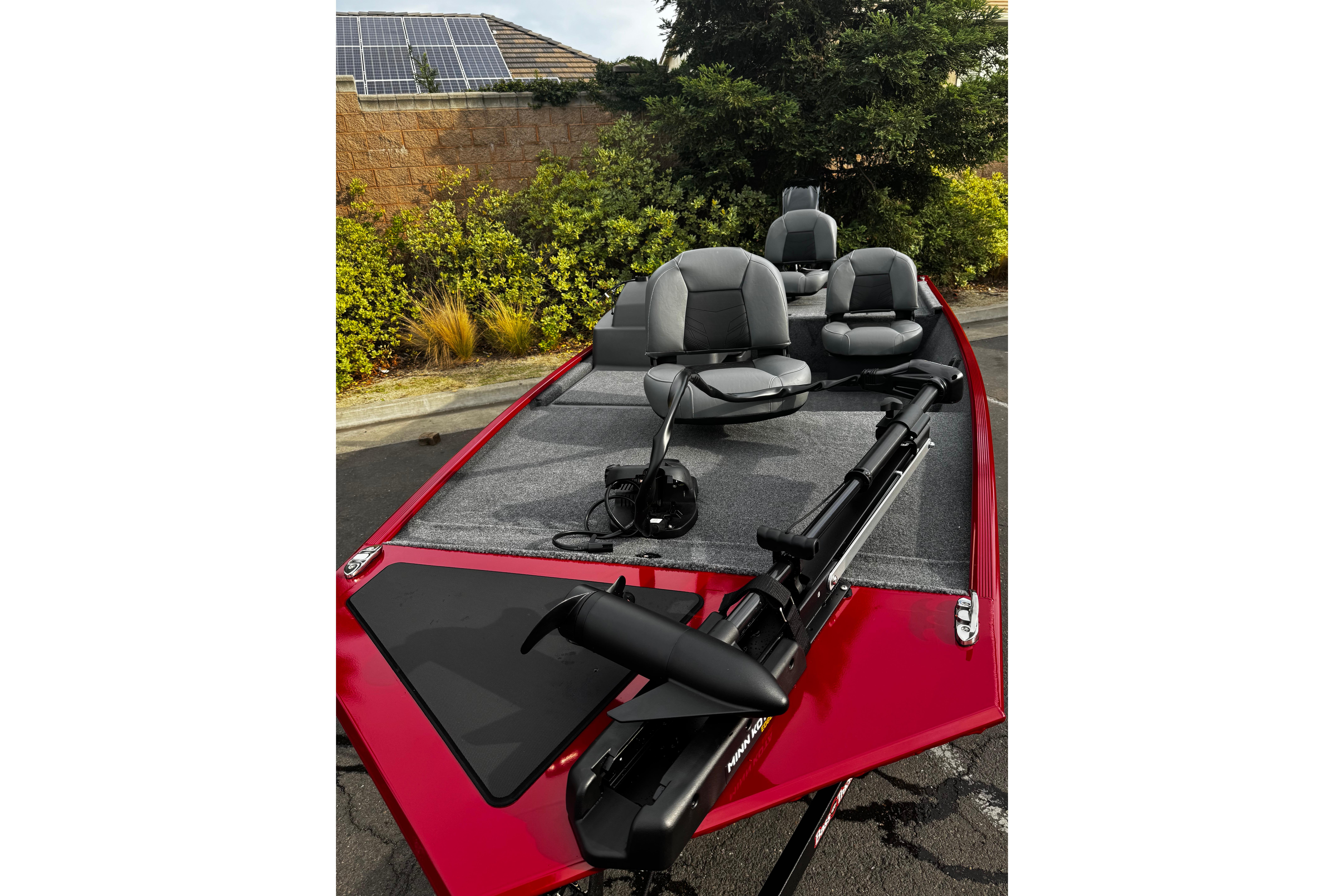2026 Tracker Bass Tracker Classic XL boat with seating and trolling motor, parked outdoors.