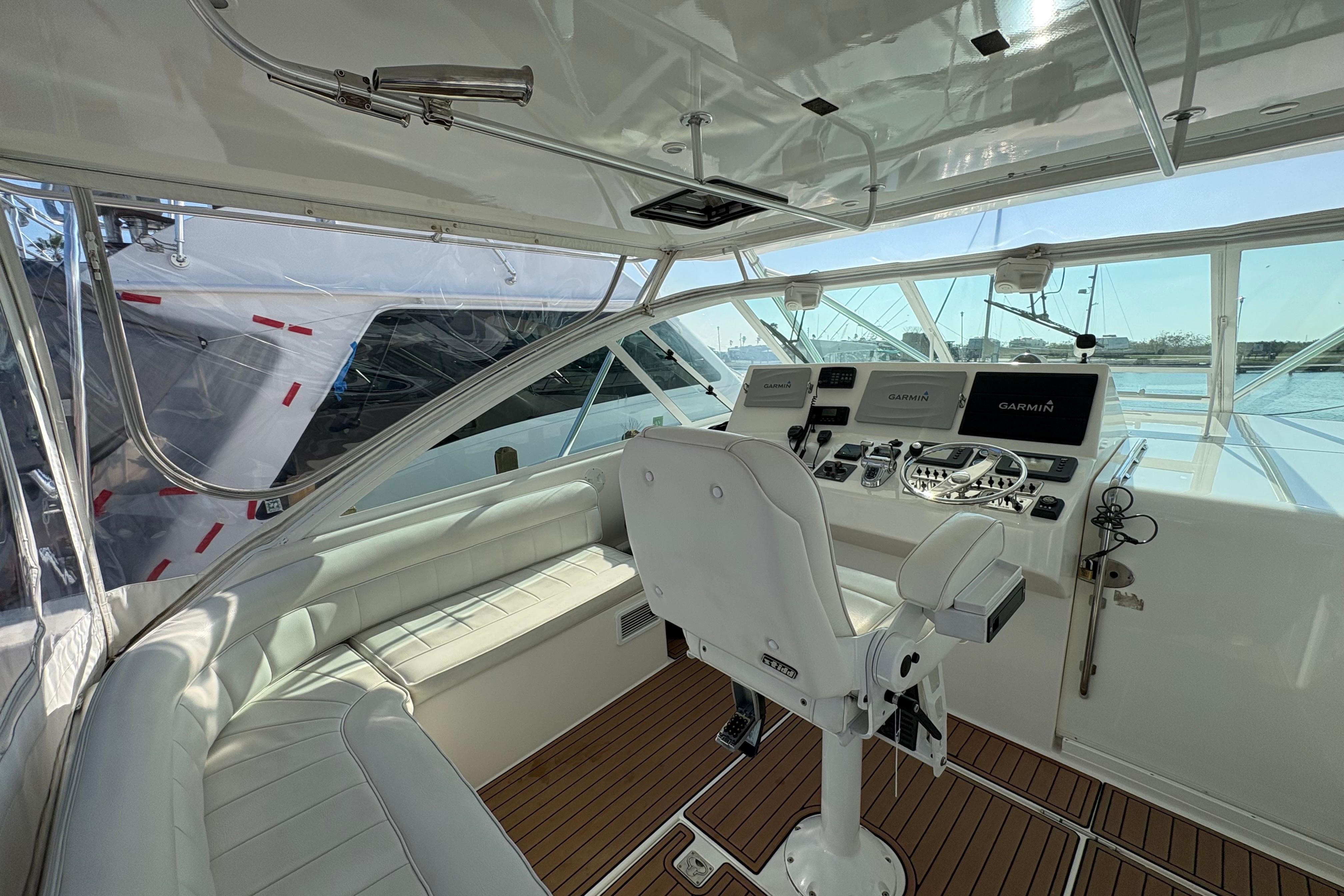 2004 Cabo 40 Hardtop Express helm with modern navigation equipment and luxurious seating.