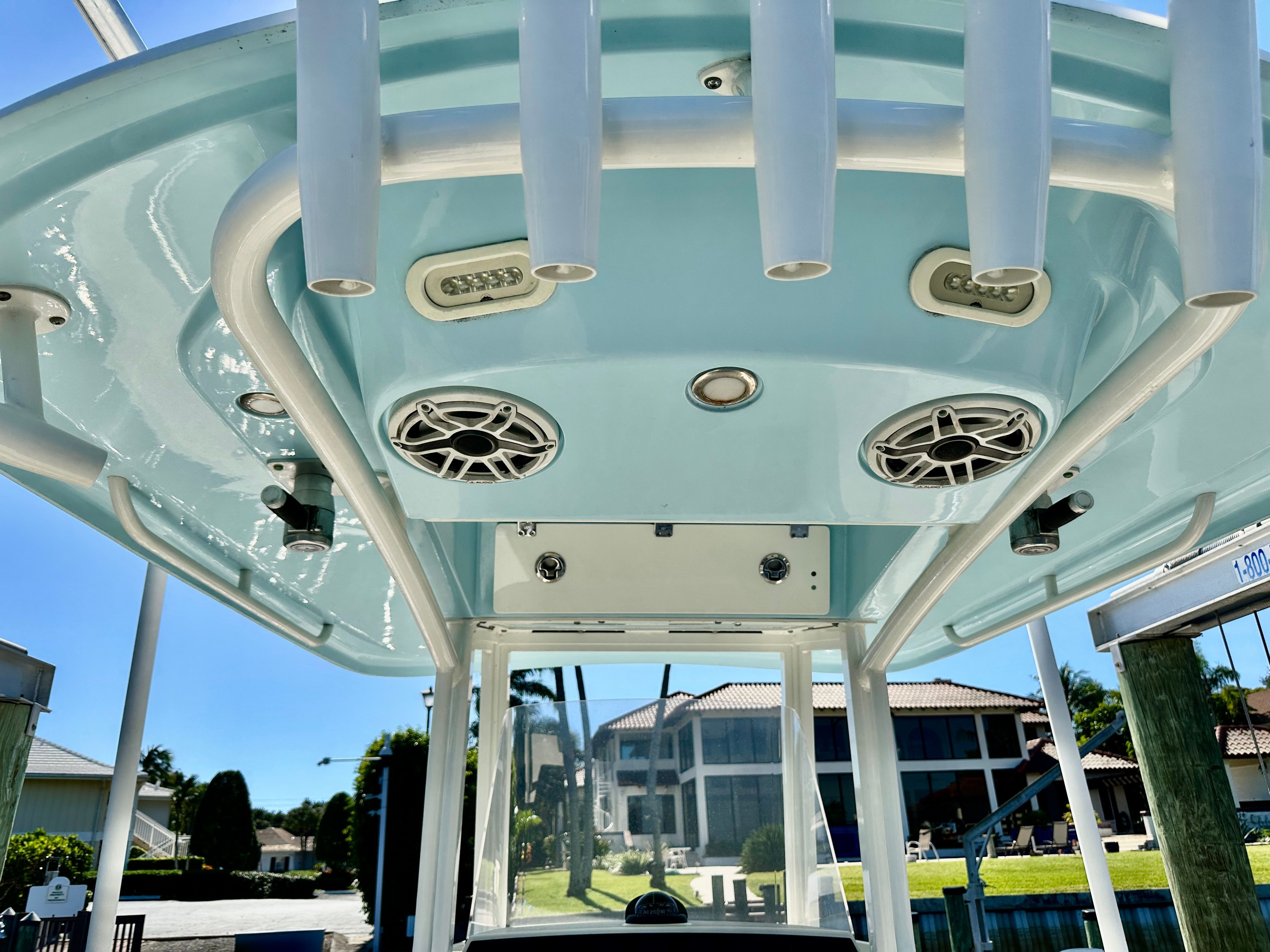 View of a Cobia 240 Center Console boat's hardtop with speakers and lights.