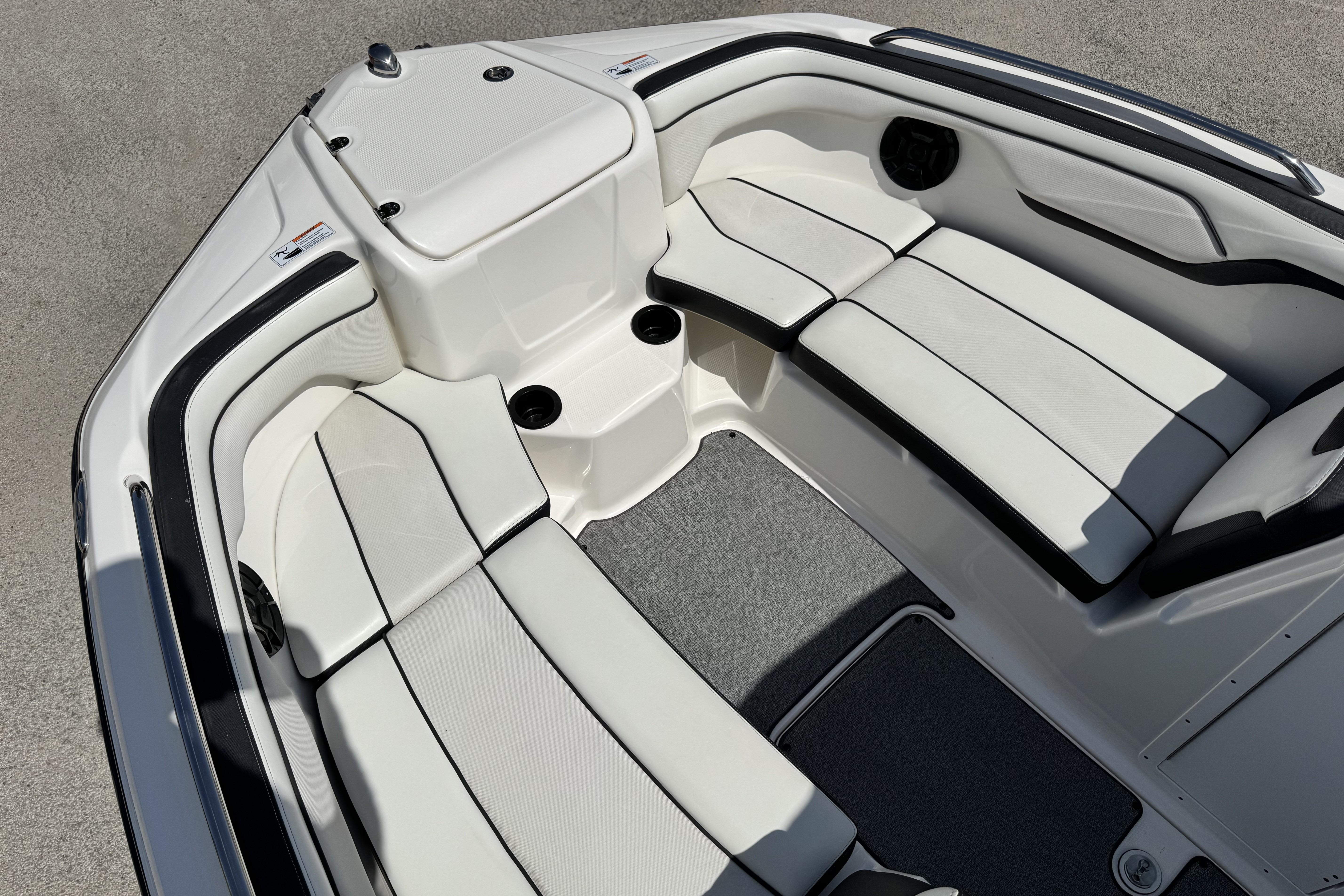 2018 Yamaha Boats AR210 interior with white seating and sleek design.