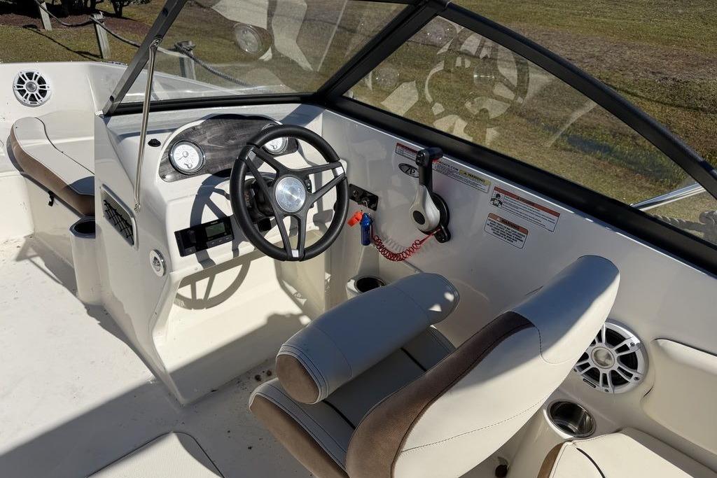 2024 Stingray 191 DC boat interior with steering wheel and seating.