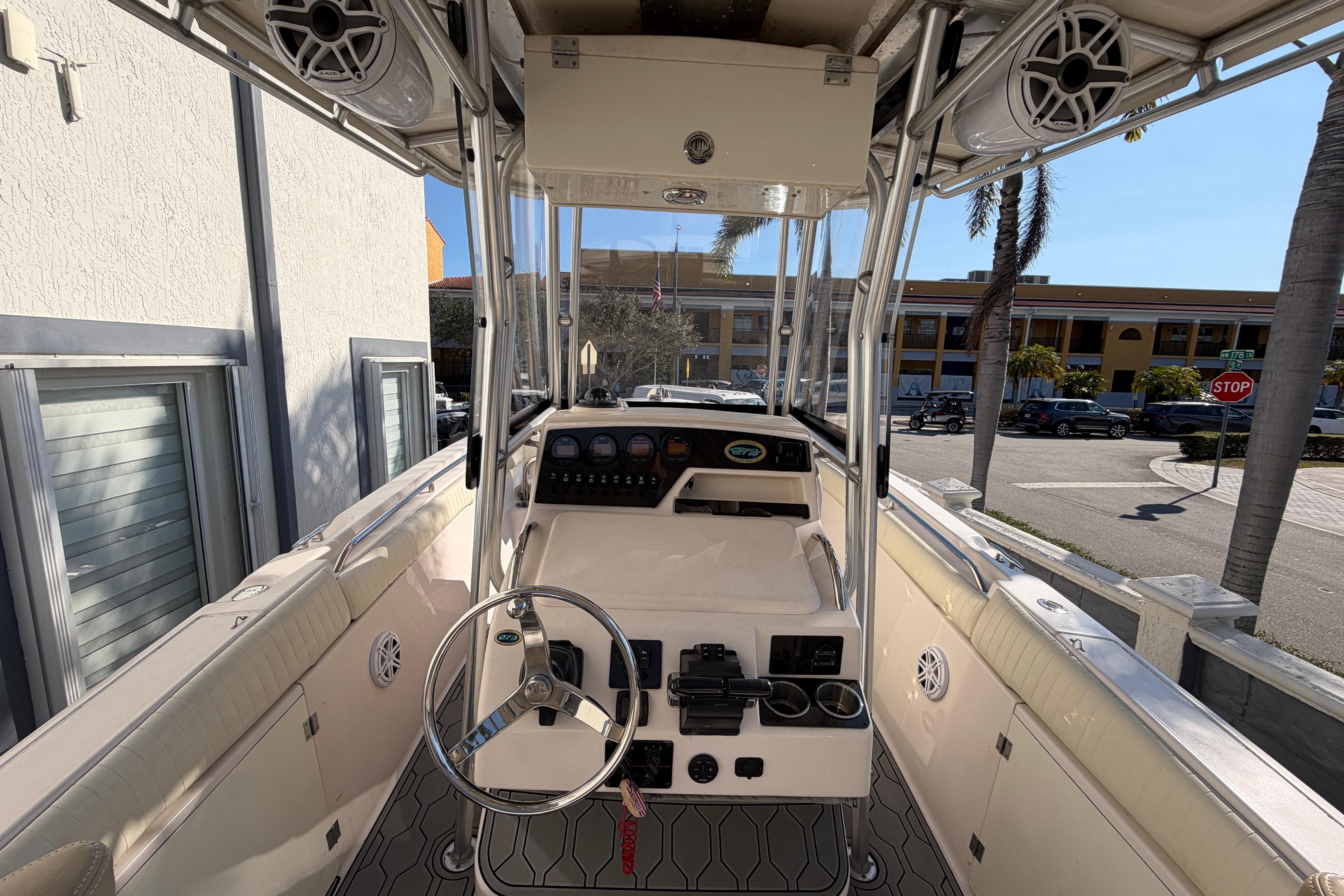 2004 Grady White 273 boat interior with steering wheel and control panel.