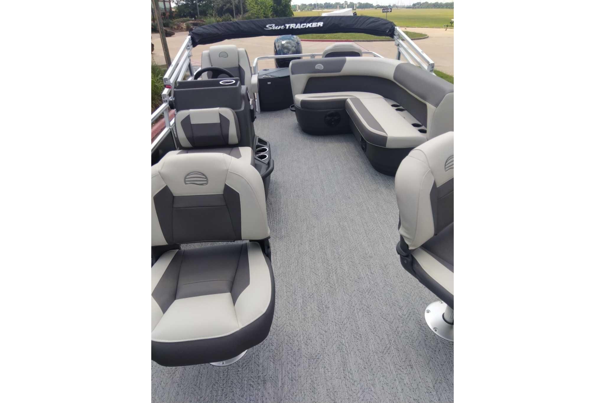 2026 Sun Tracker Bass Buggy 18 DLX interior with gray seating and spacious layout.