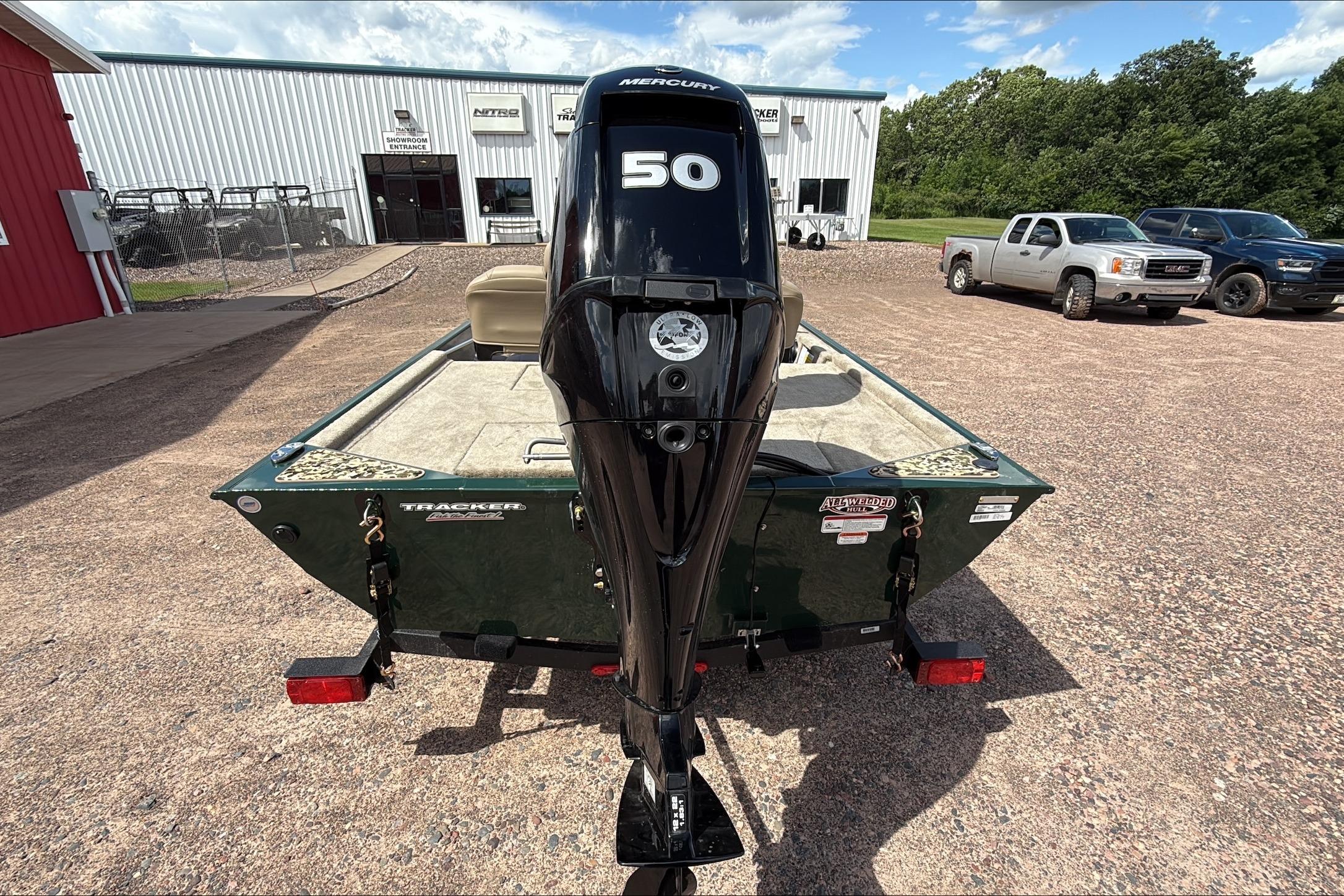2026 Tracker Bass Tracker Classic Limited boat with Mercury 50 engine in a dealership lot.