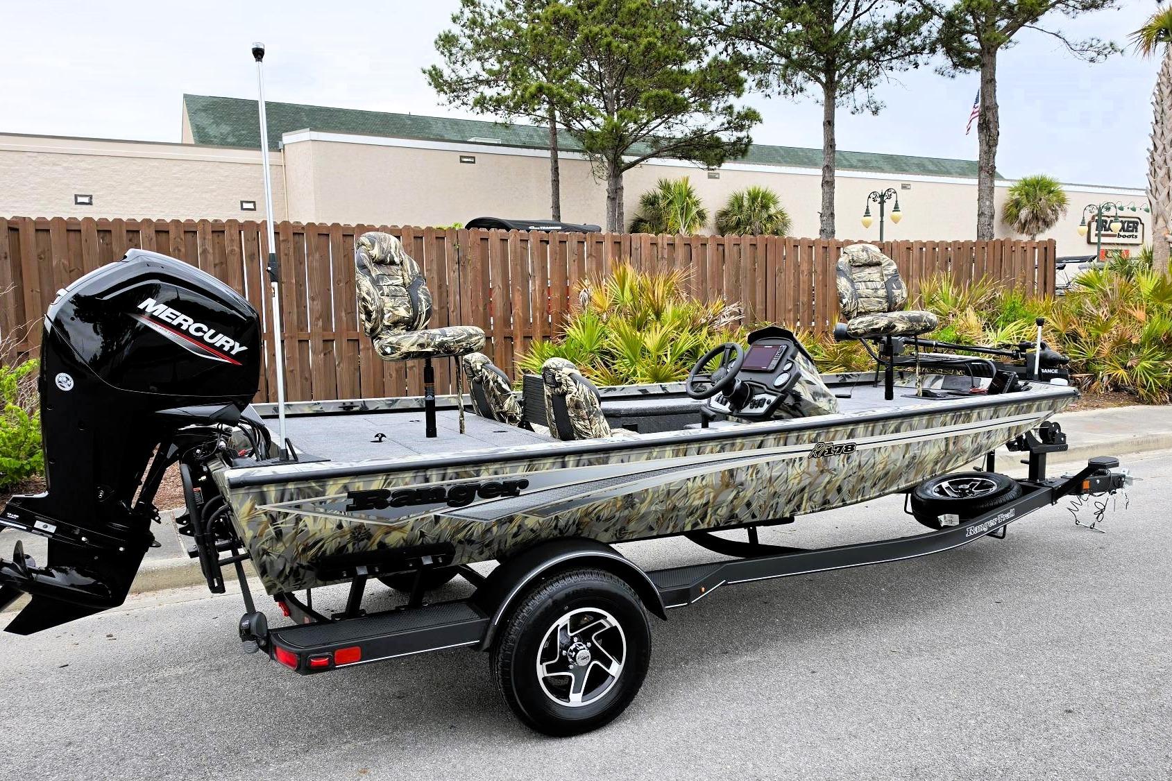 2026 Ranger RT178 fishing boat with camouflage seats and Mercury outboard motor.
