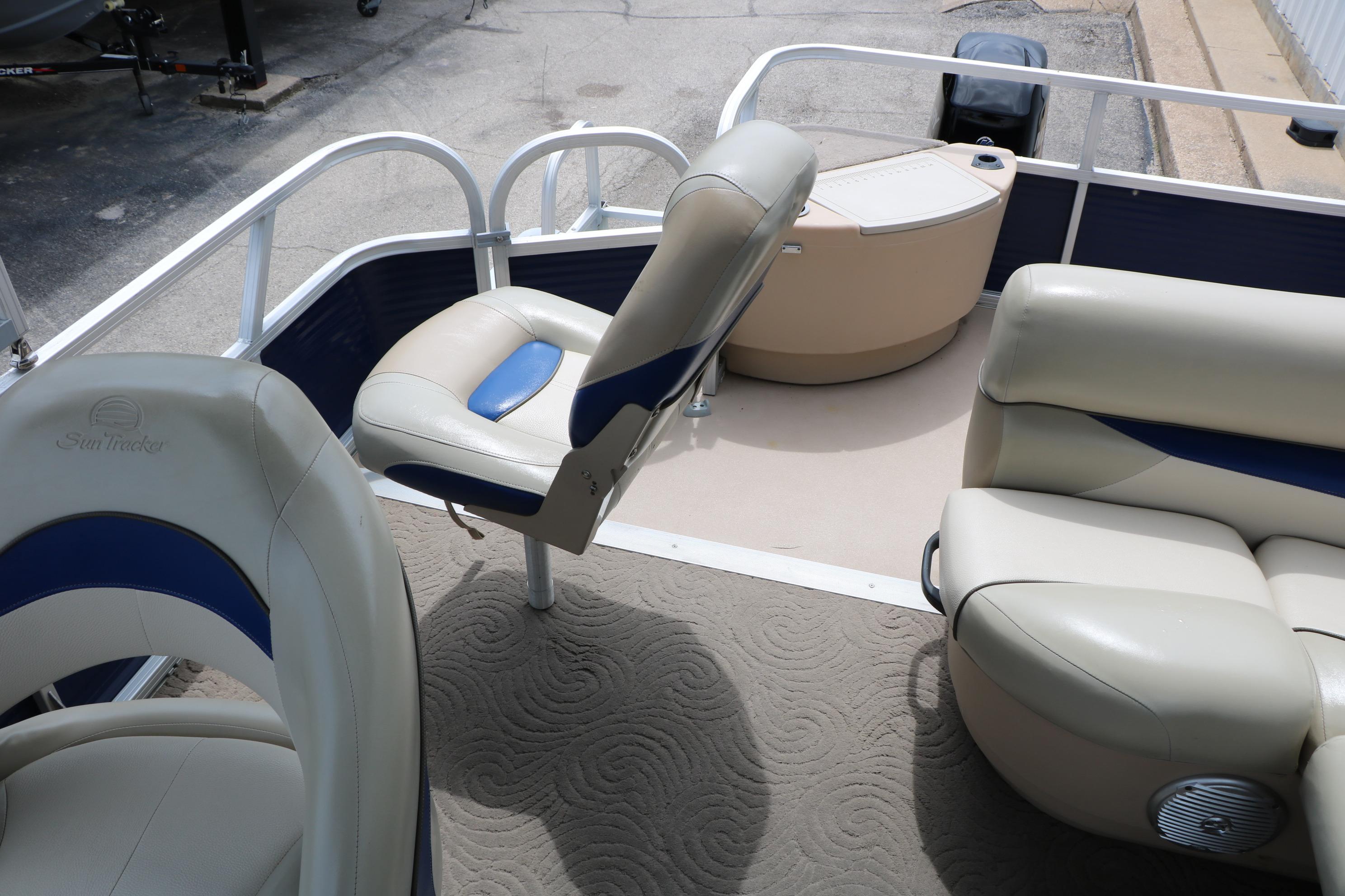 2013 Sun Tracker Fishin' Barge 20 DLX interior with comfortable seating and fishing amenities.