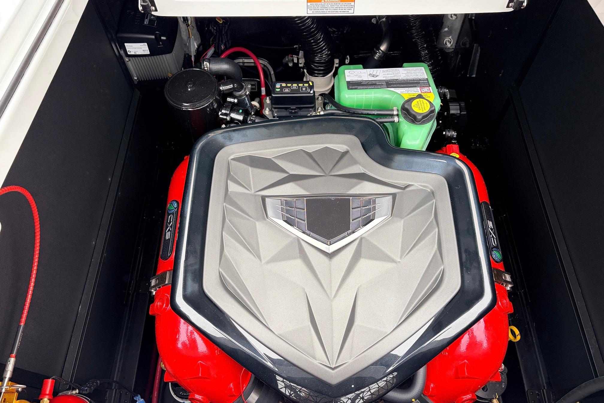 Engine compartment of 2026 Nautique Super Air Nautique G25 boat, featuring a powerful engine.