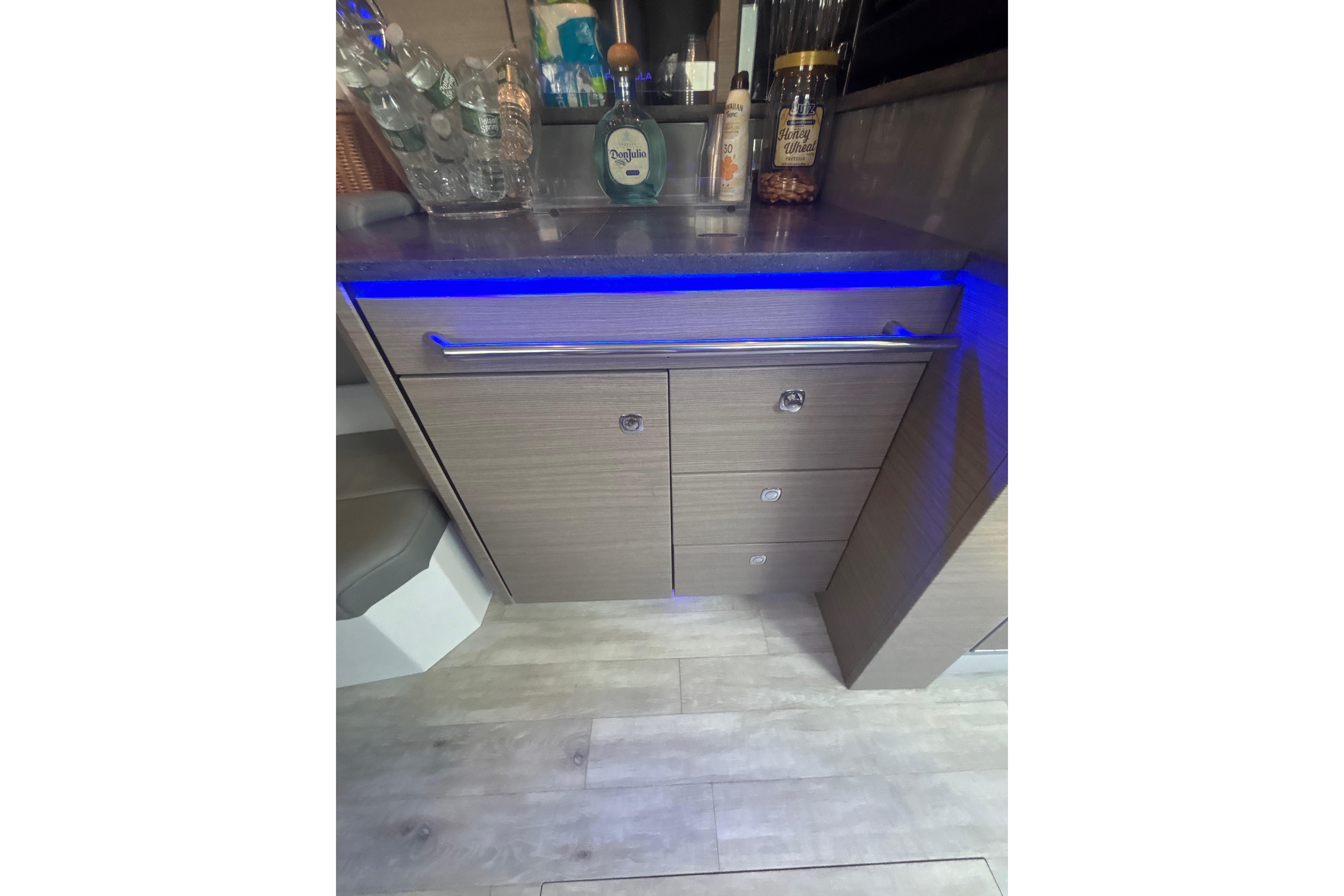 2019 Formula 430 Super Sport Crossover interior with modern cabinetry and blue LED lighting.