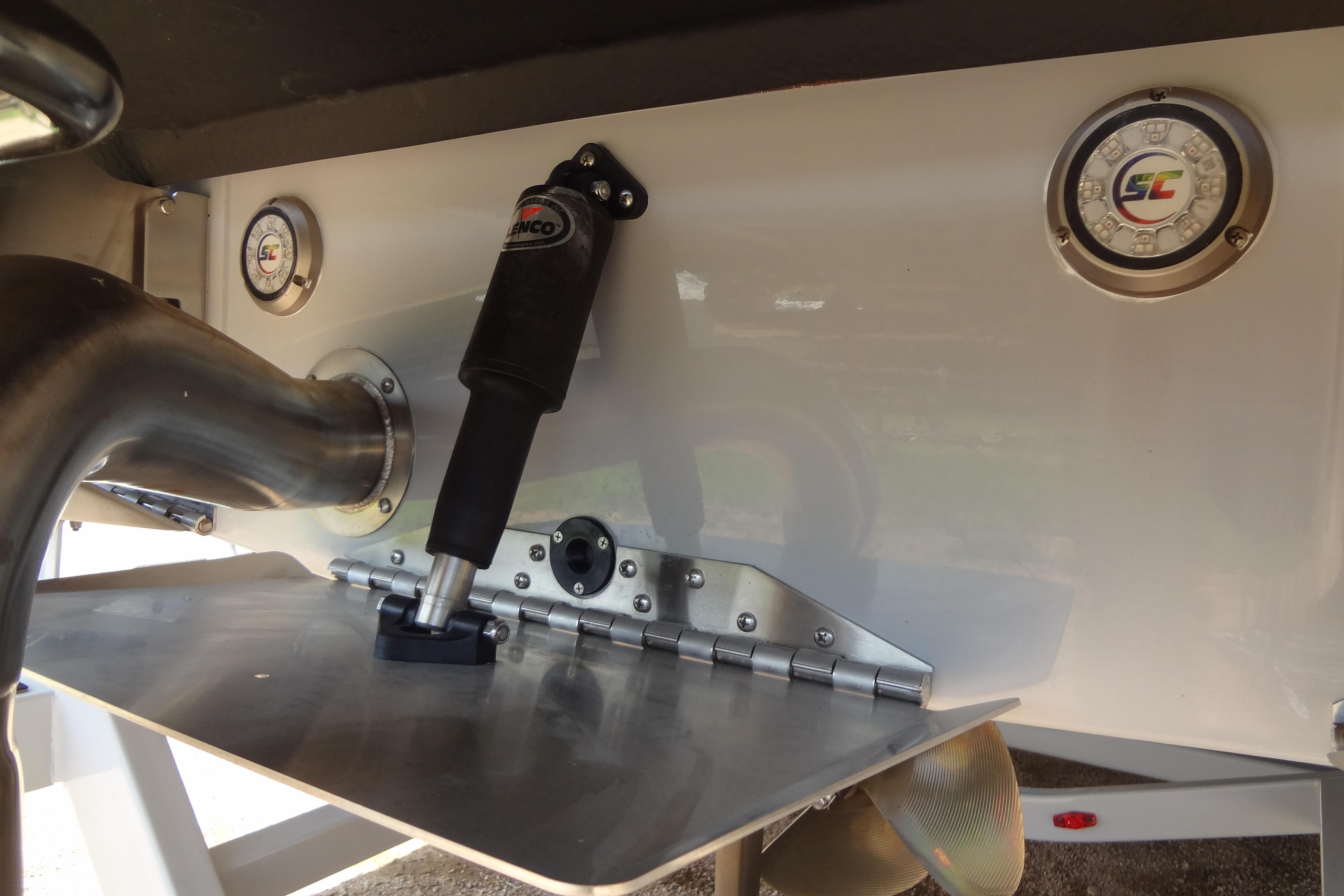 2022 ATX Surf Boats 24 Type-S transom with trim tab and exhaust details.