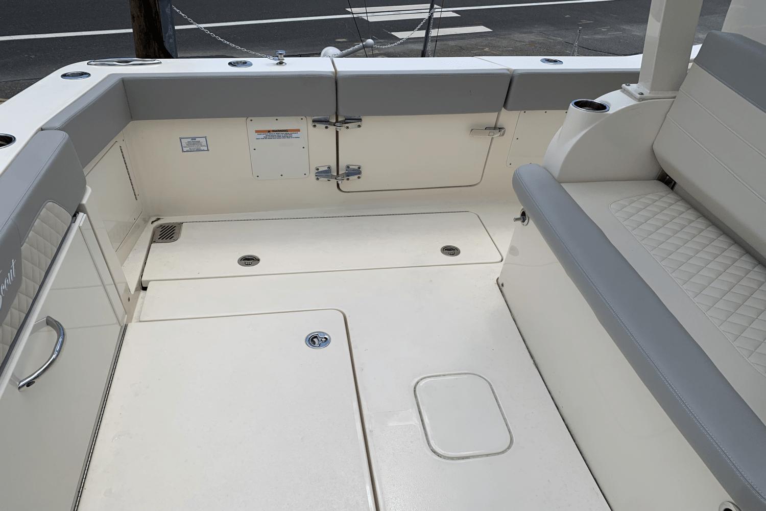 2024 Scout 357LXF boat interior with cushioned seating and storage compartments.