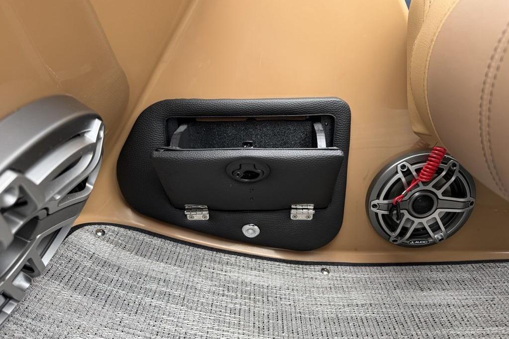 Interior of 2026 Godfrey Monaco 235 SFLC iMPACT with speaker and storage compartment.