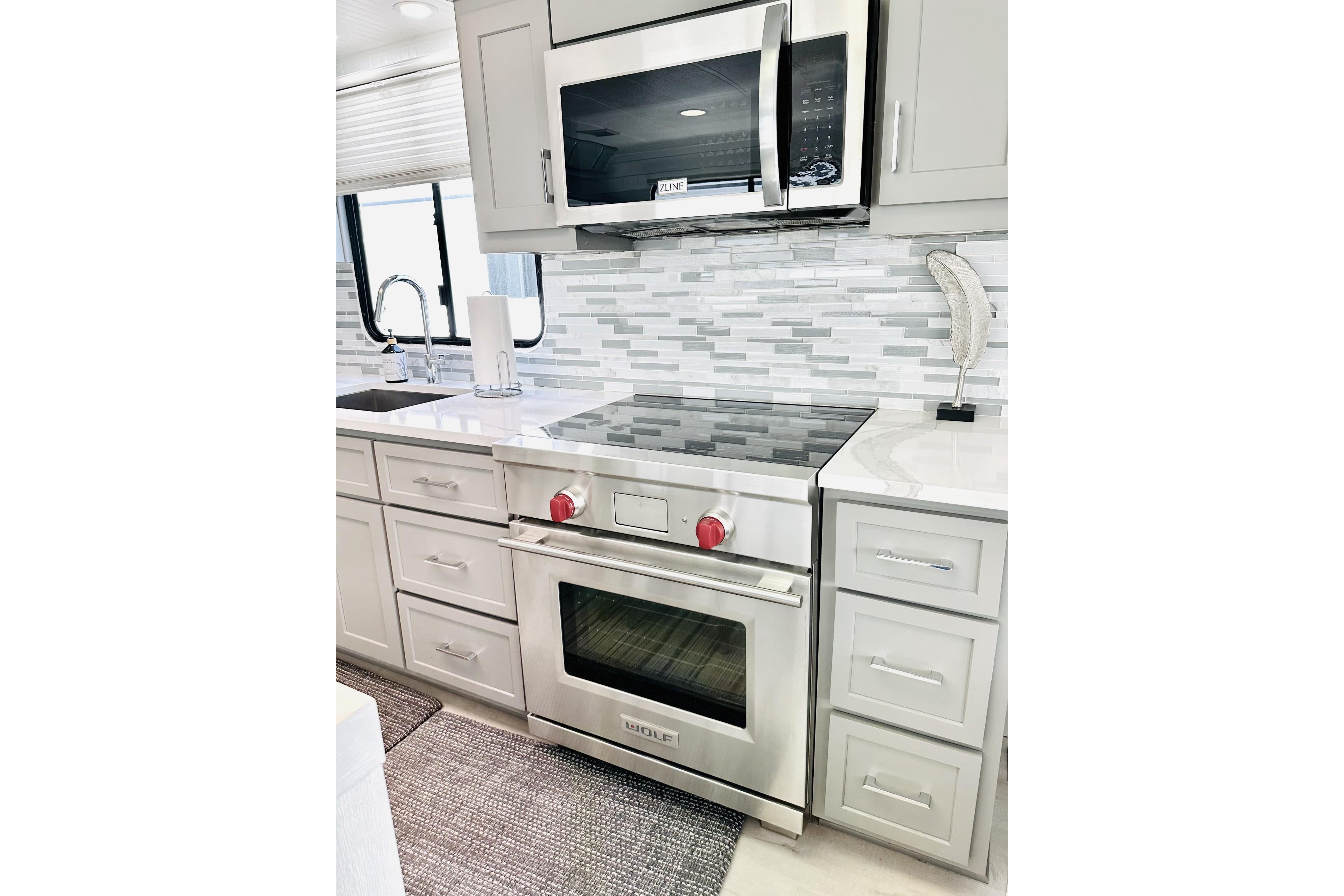 Modern kitchen in 1992 Sumerset 66 houseboat with stainless steel appliances and sleek cabinetry.