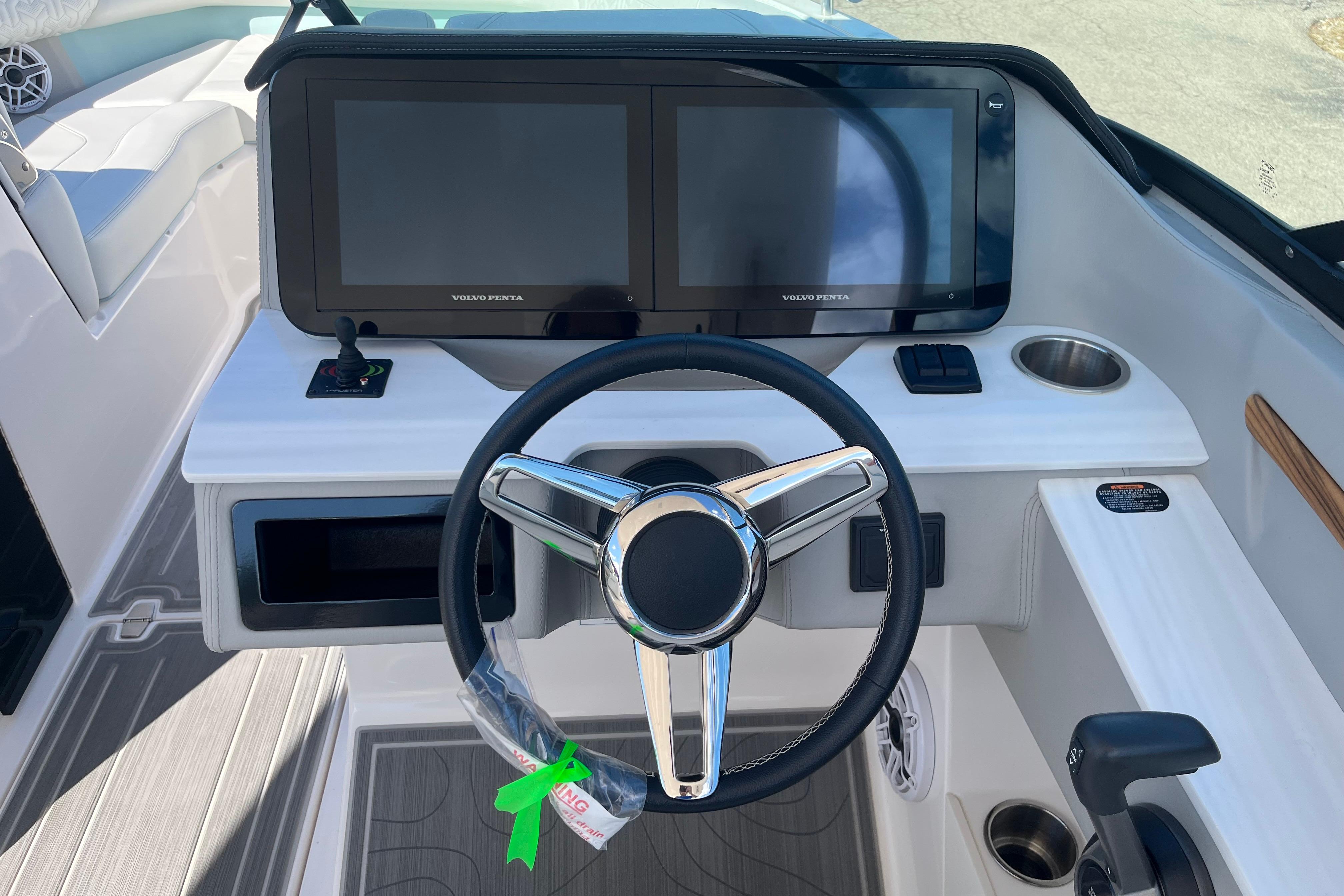 2024 Regal LS9 Surf boat dashboard with dual screens and steering wheel.