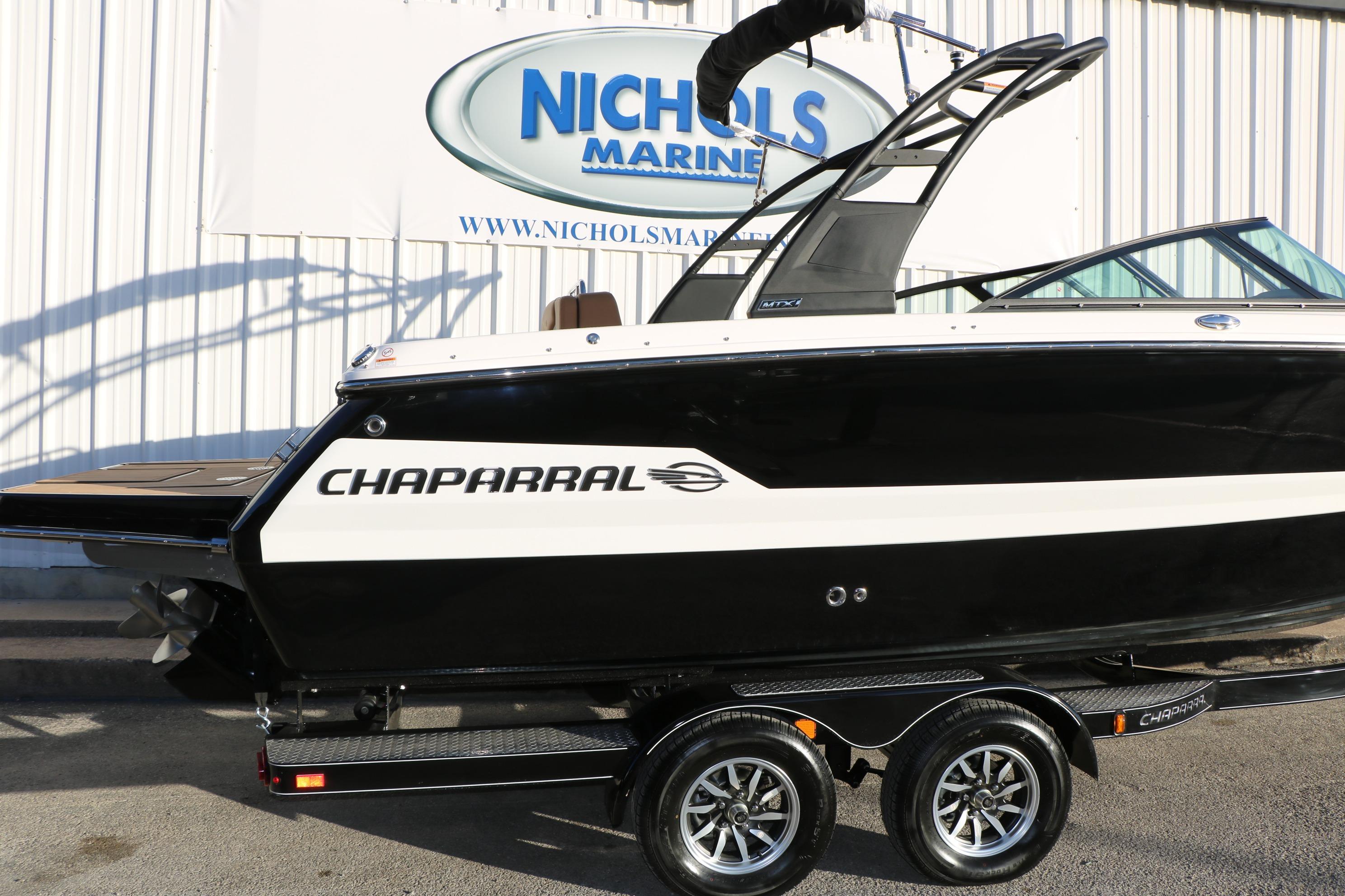 2026 Chaparral 247 SSX boat on trailer at Nichols Marine dealership.