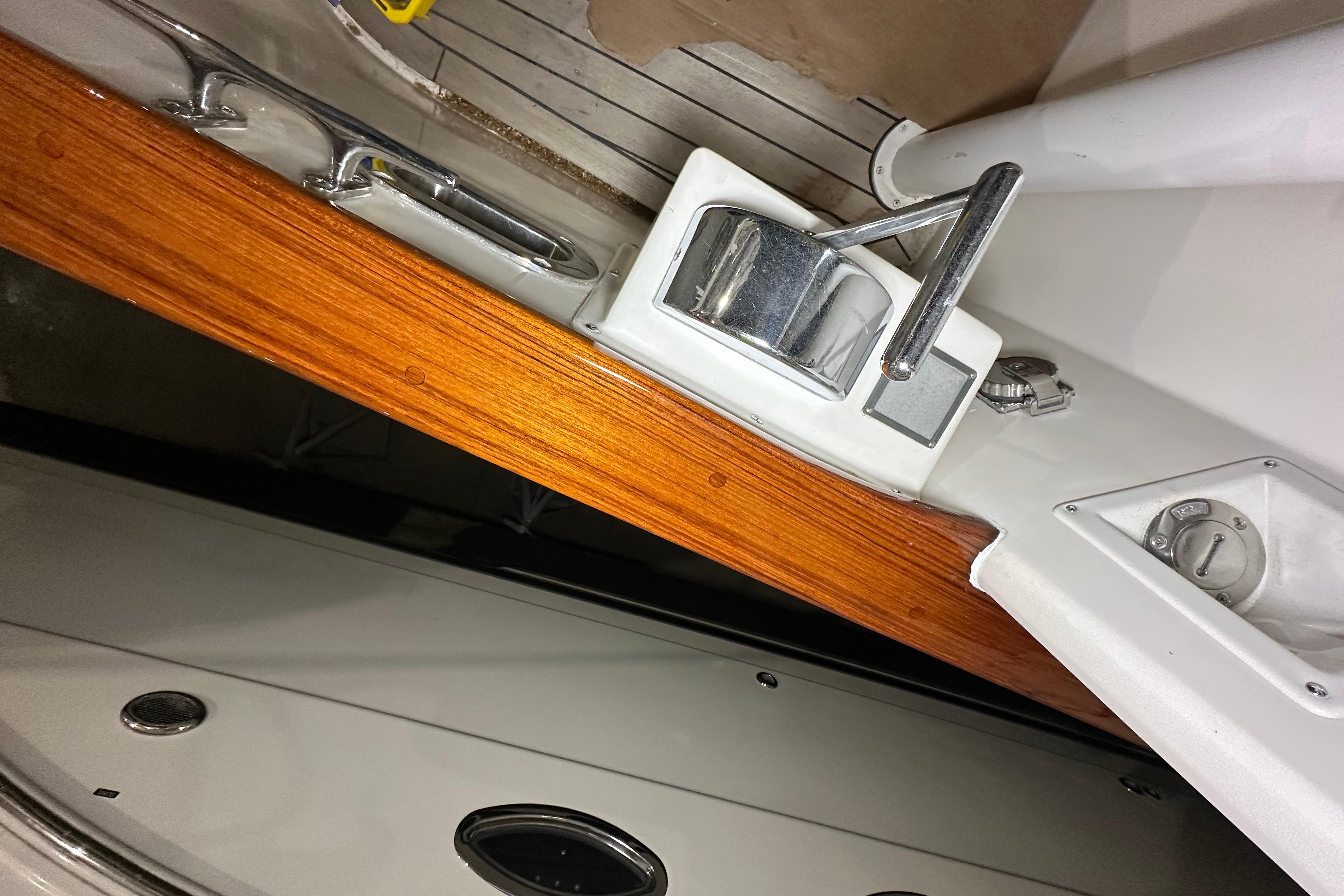 Cherubini Independence 45 yacht deck detail, featuring wood trim and metal fittings, 2001 model.