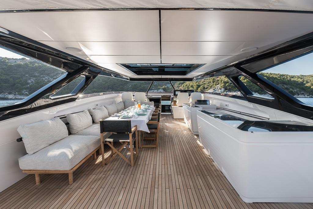 Luxurious 2024 Ferretti Yachts 1000 interior with elegant dining area and panoramic views.