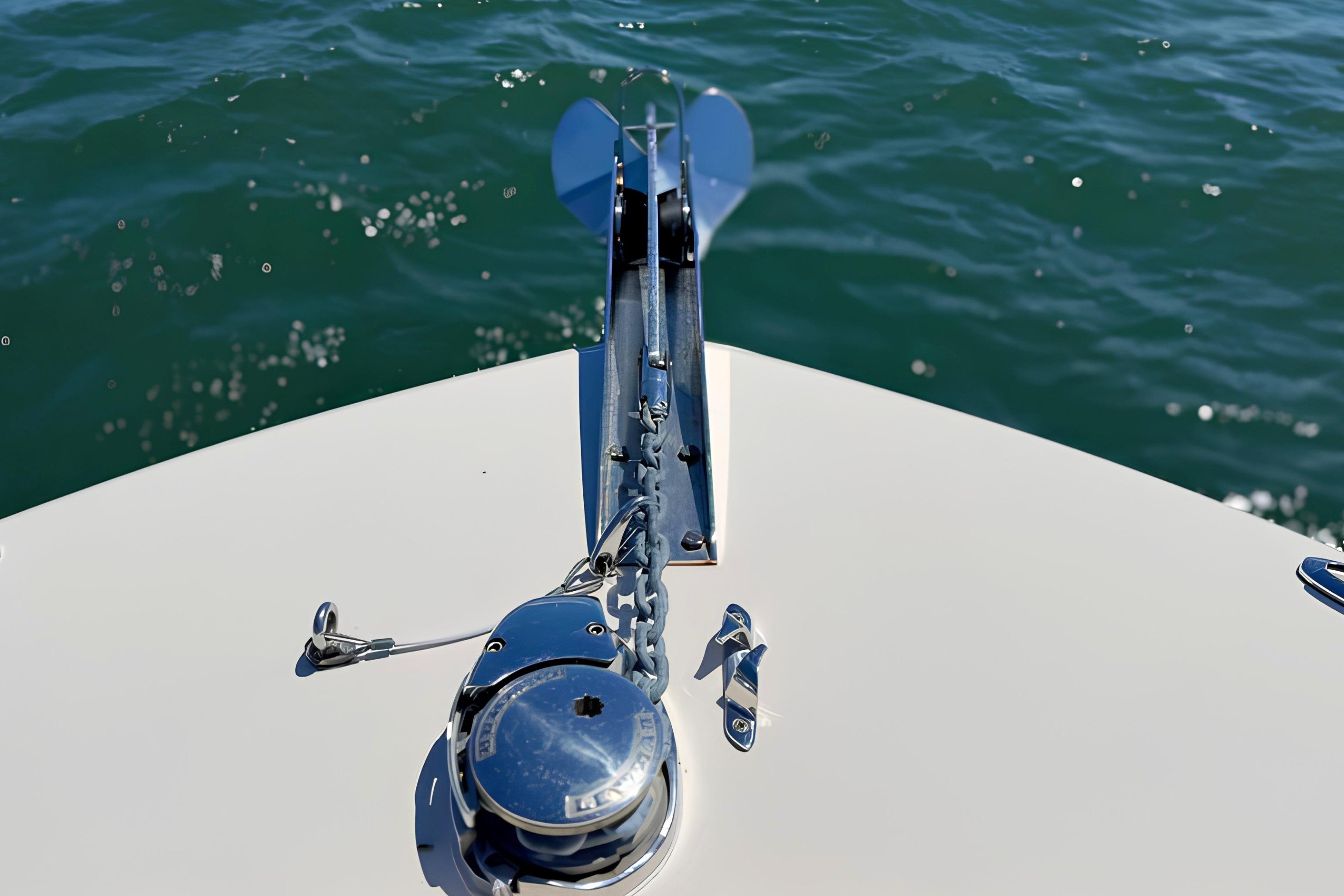 Bow of 2017 Grady-White Freedom 235 boat with anchor, on water.