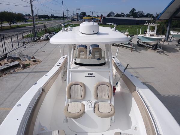 2015 Sea Fox 286 Commander boat with dual seating, docked outdoors.