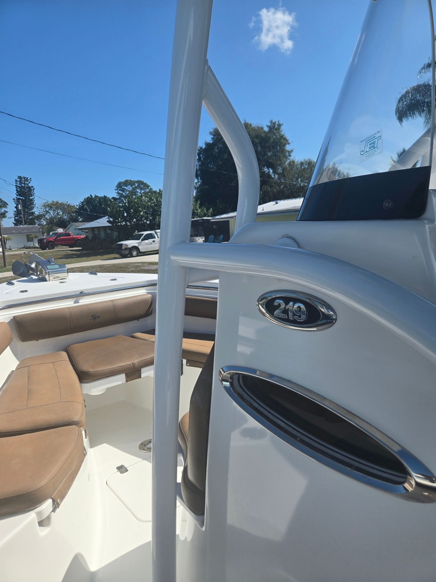 2018 Sea Pro 21.9 boat with brown seats and blue sky.