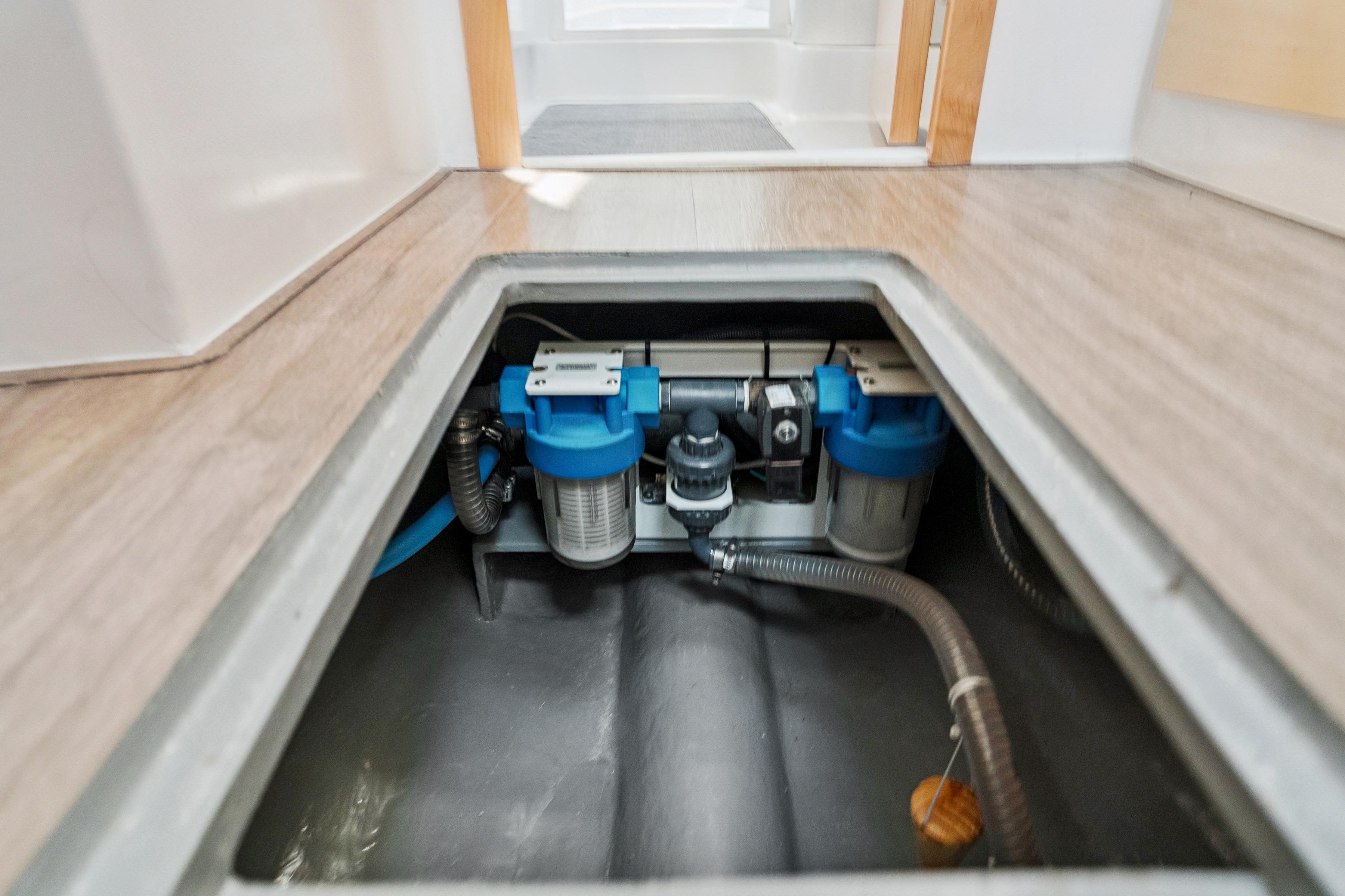 2024 St Francis 460 yacht interior showing underfloor water filtration system.