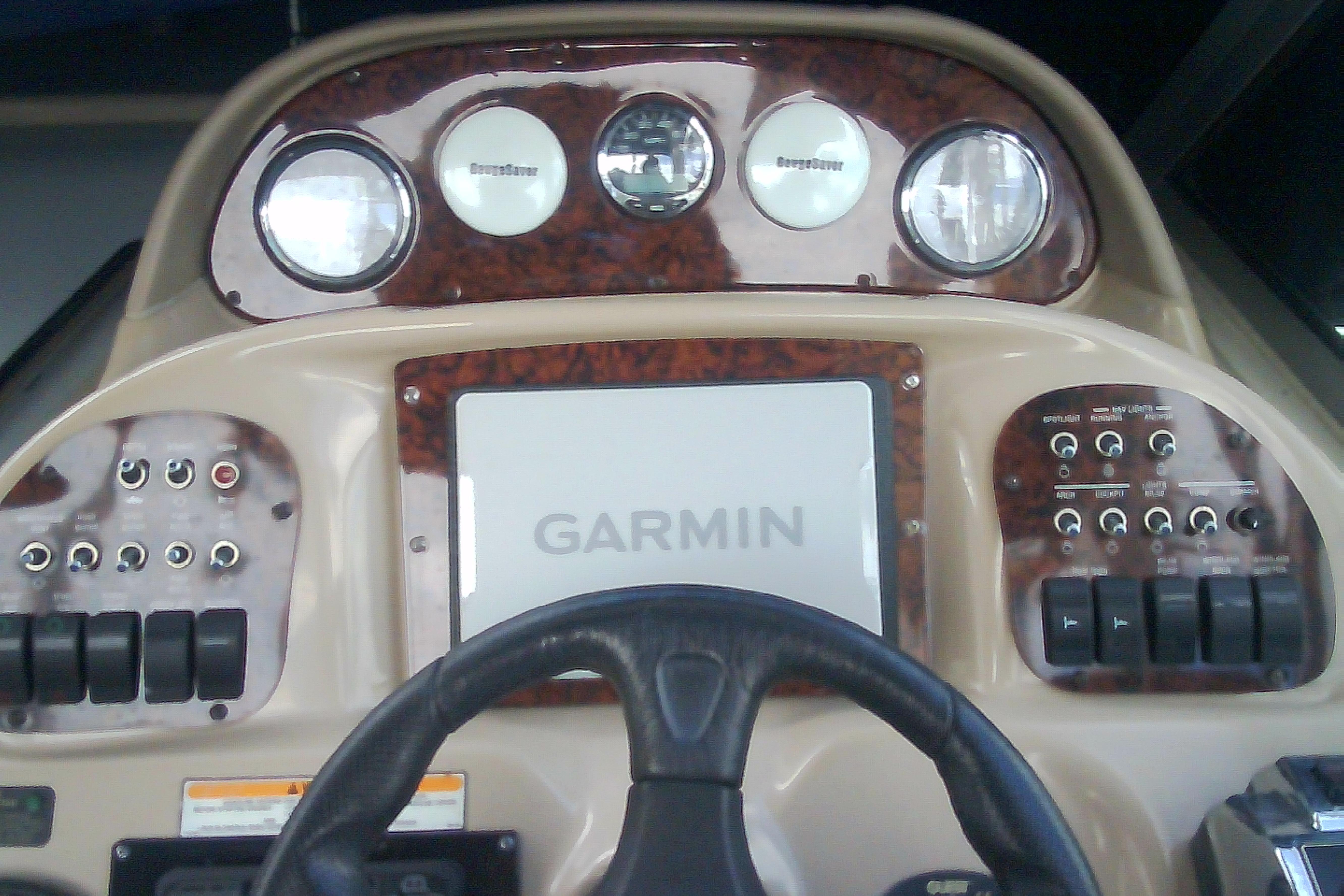 Dashboard of 2005 Sea Ray 300 Sundancer with Garmin navigation system.