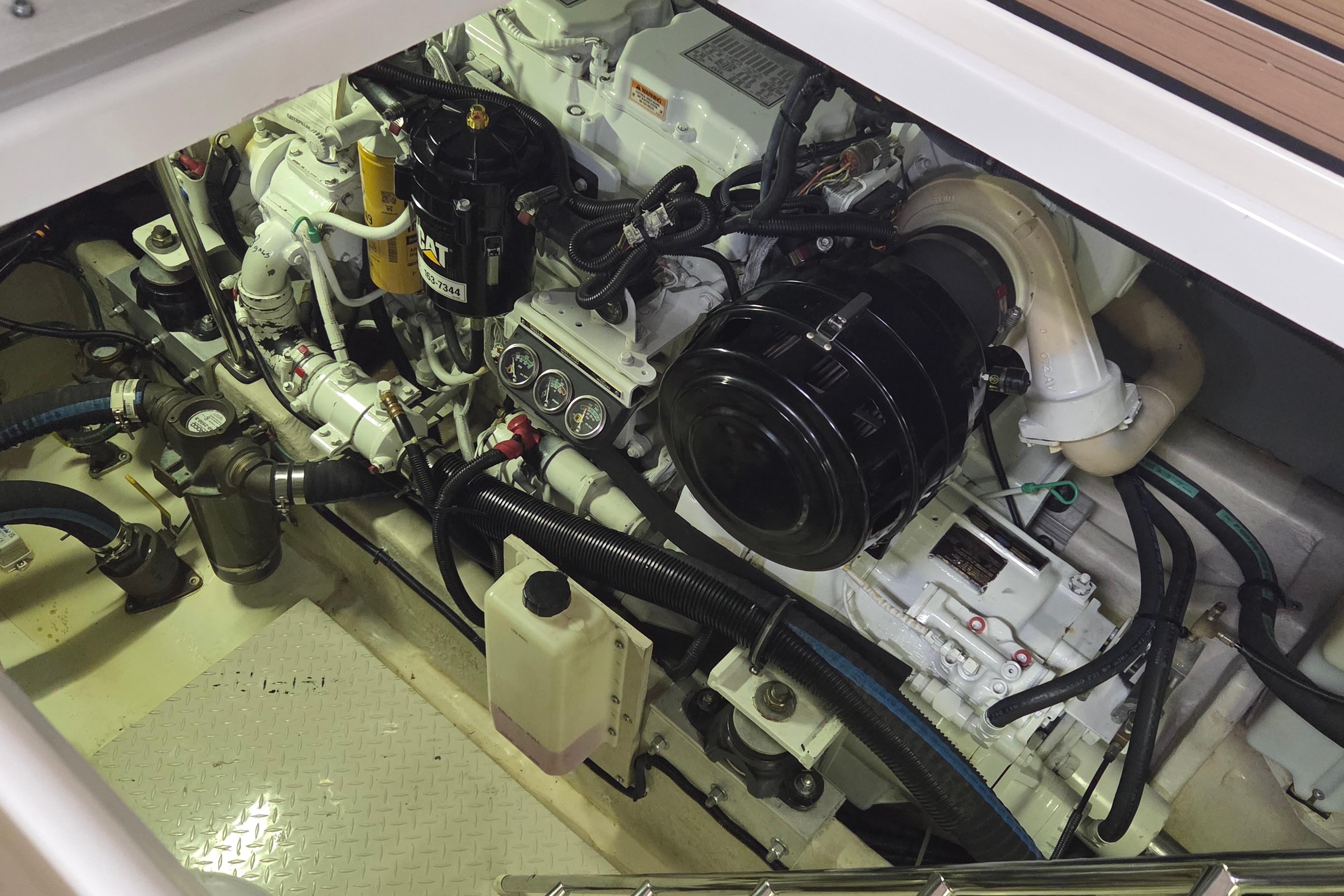 Engine compartment of a 2000 Sea Ray Sundancer 540 yacht, showcasing detailed machinery.