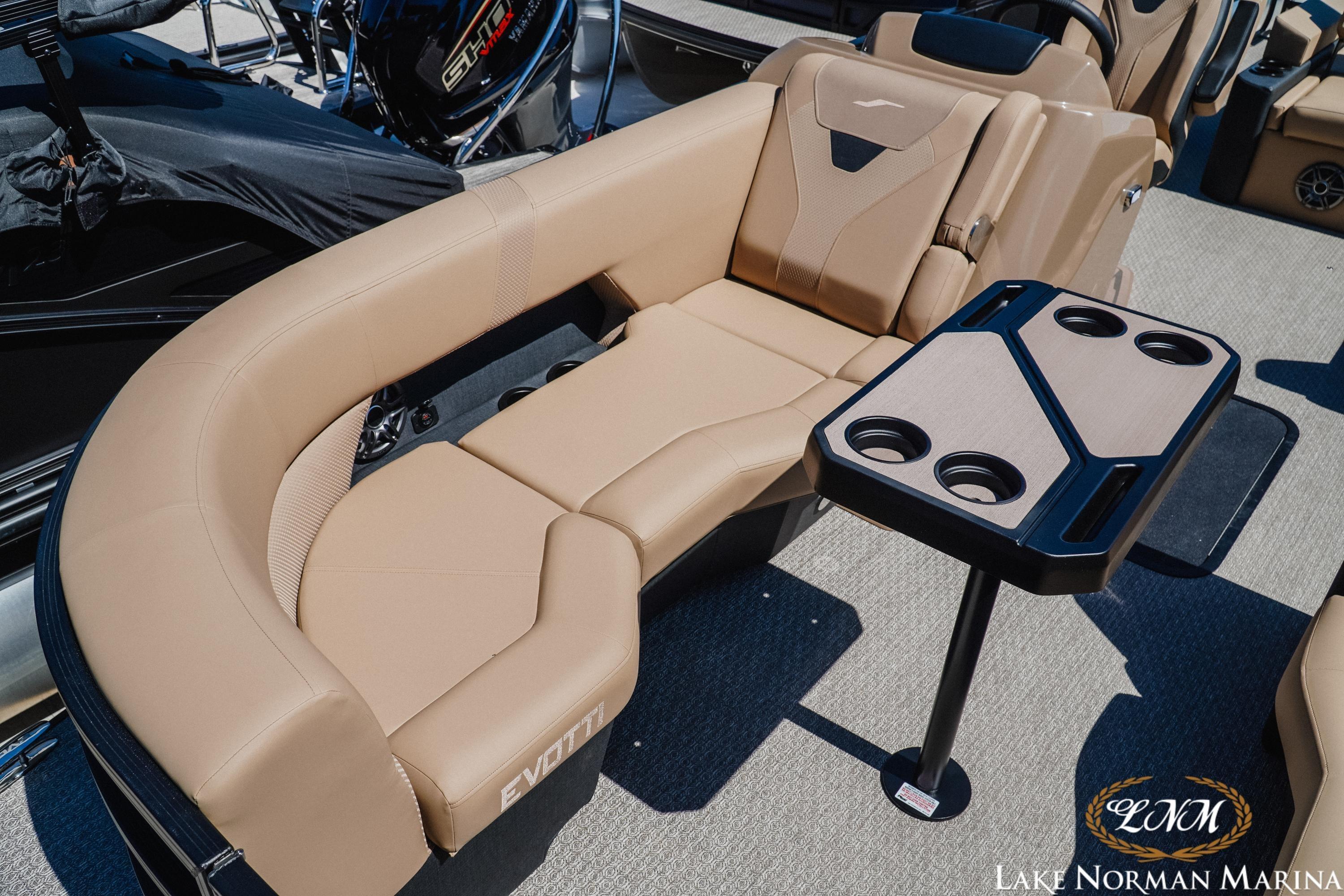 Luxurious seating on 2026 Evotti 523CS boat with cup holders at Lake Norman Marina.