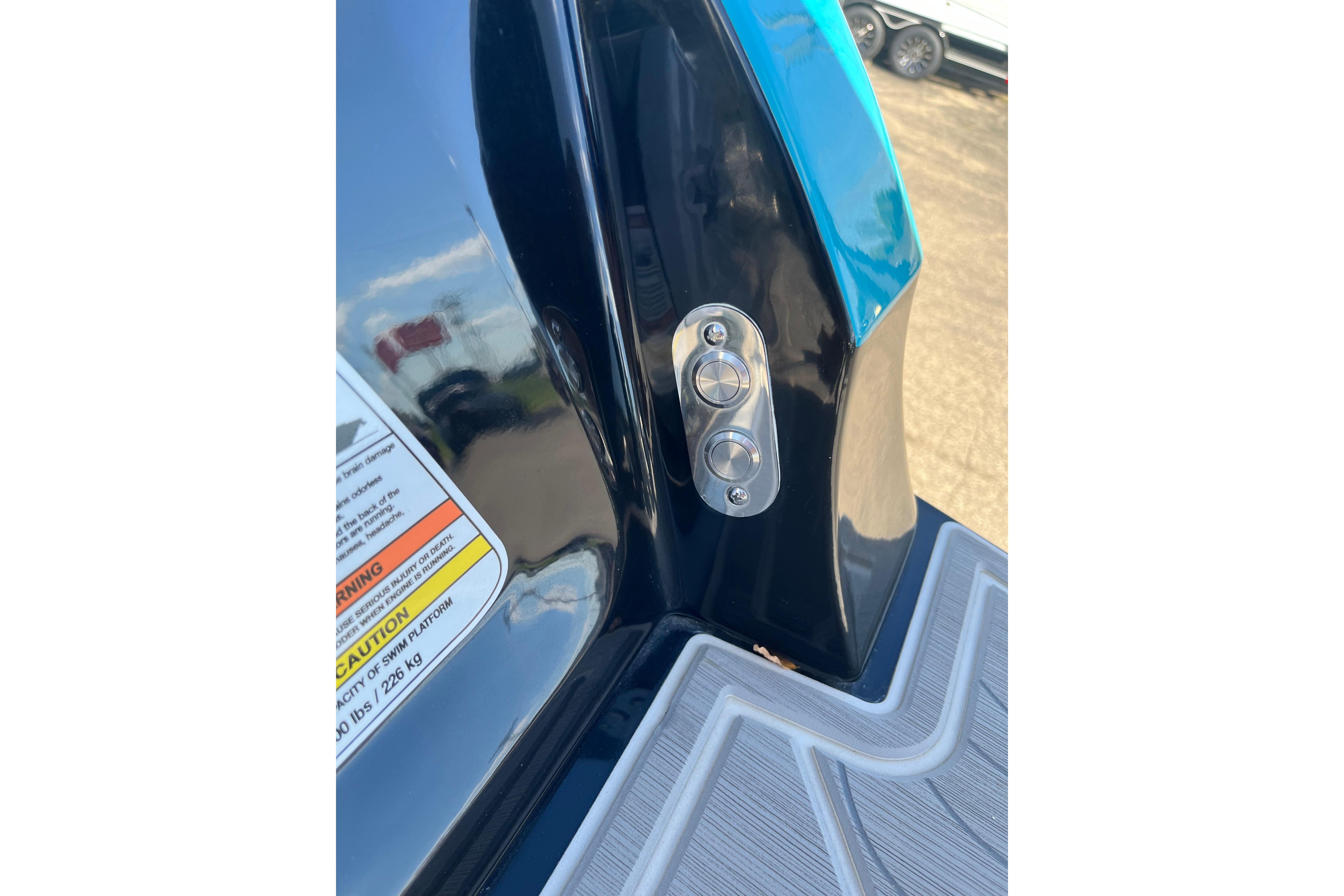 2024 Regal LS9 Surf boat detail with control buttons and caution label.