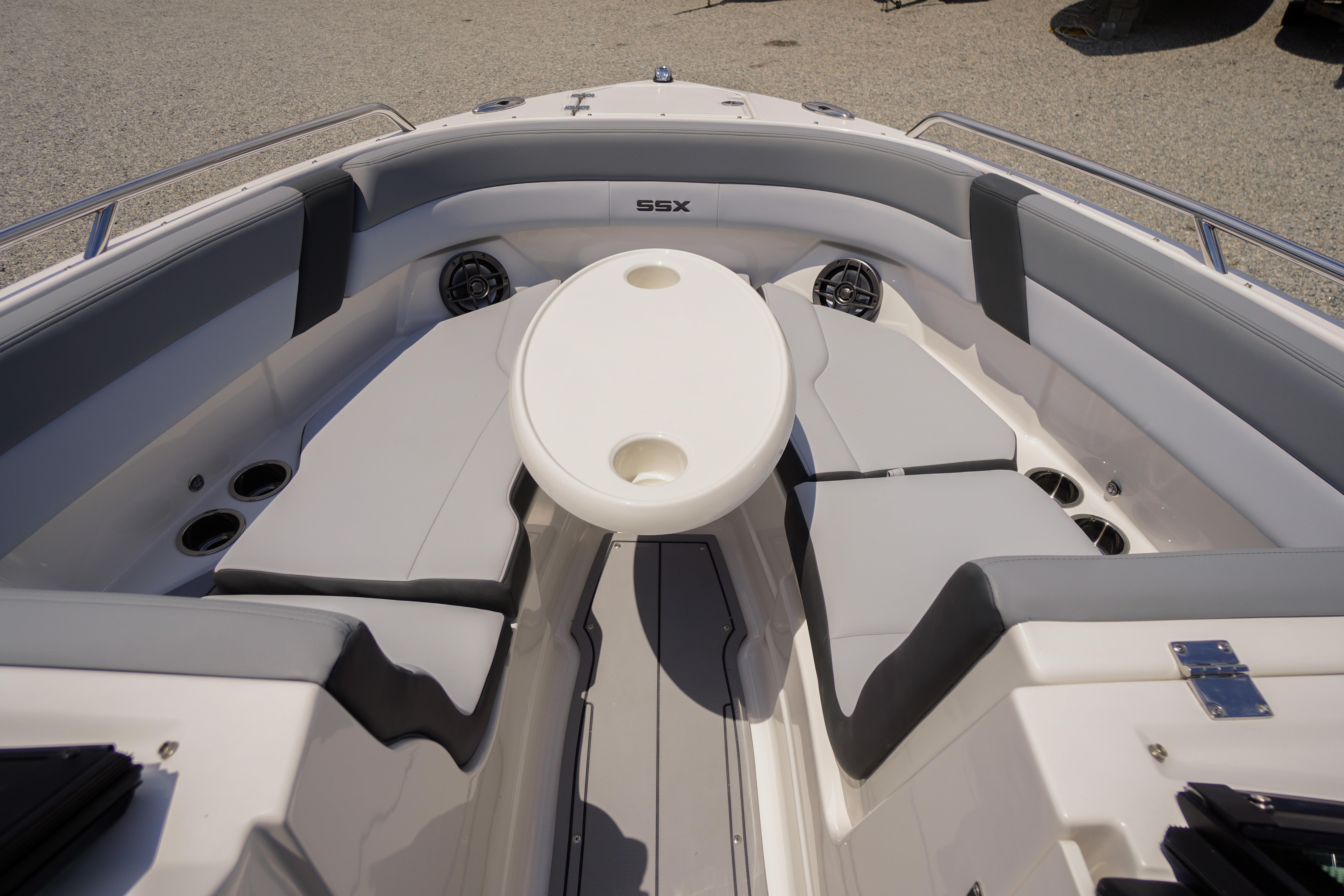 2026 Chaparral SSX 4 boat interior with cushioned seating and round table.