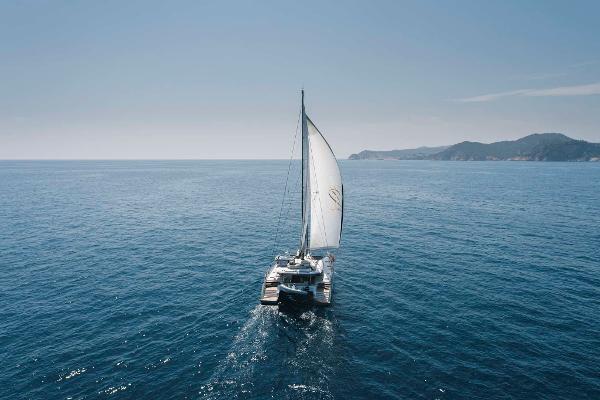 Sailing catamaran Privilege Signature 580, 2025 model, cruising on open sea.