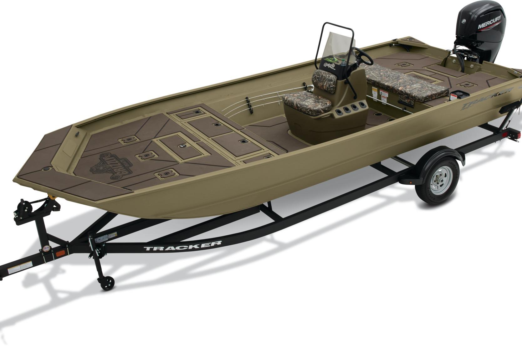 2025 Tracker Grizzly 2072 CC boat on trailer, featuring camouflage seating and Mercury outboard motor.