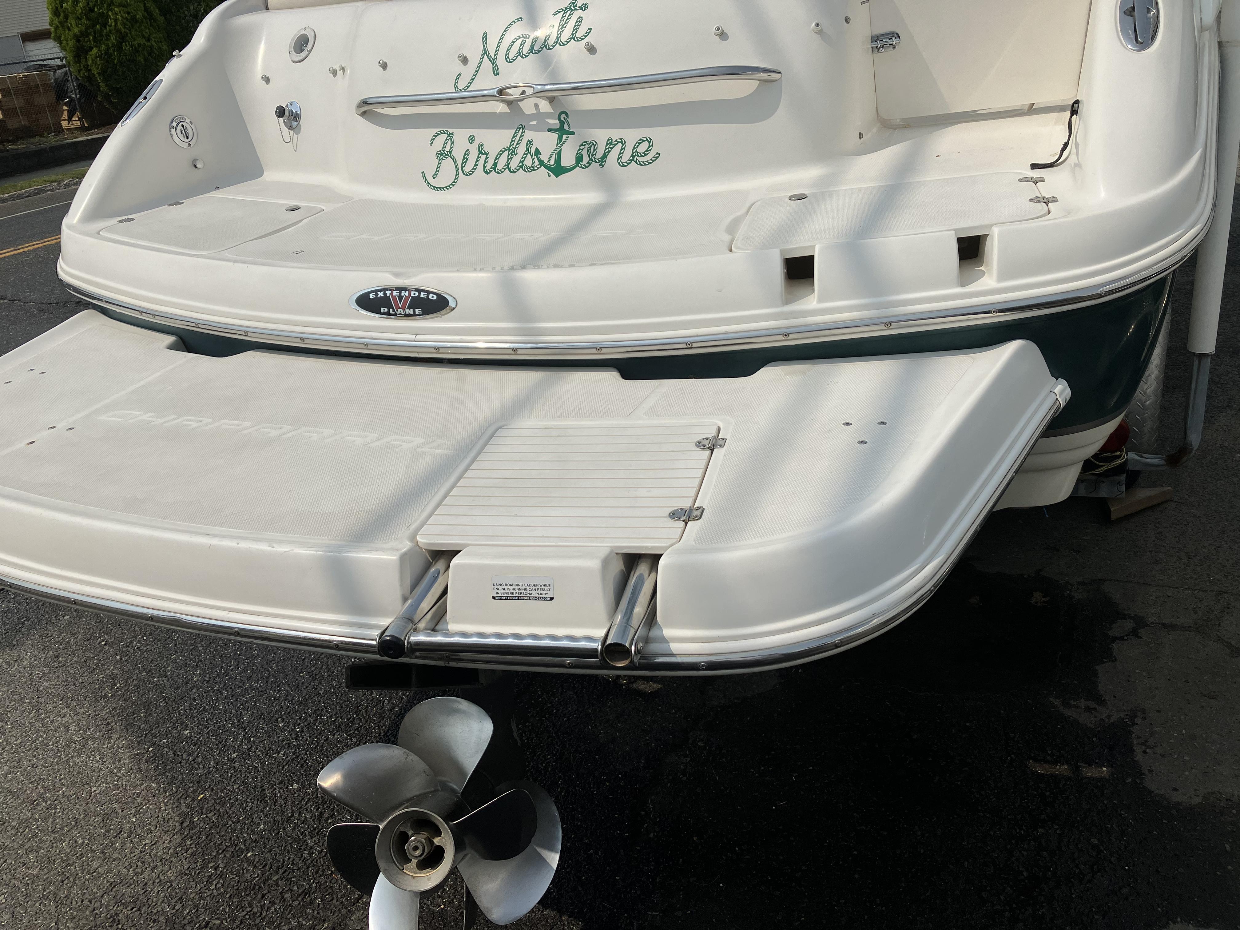 The image shows the stern of a 2001 Chaparral 235 SSi boat with a swim platform.