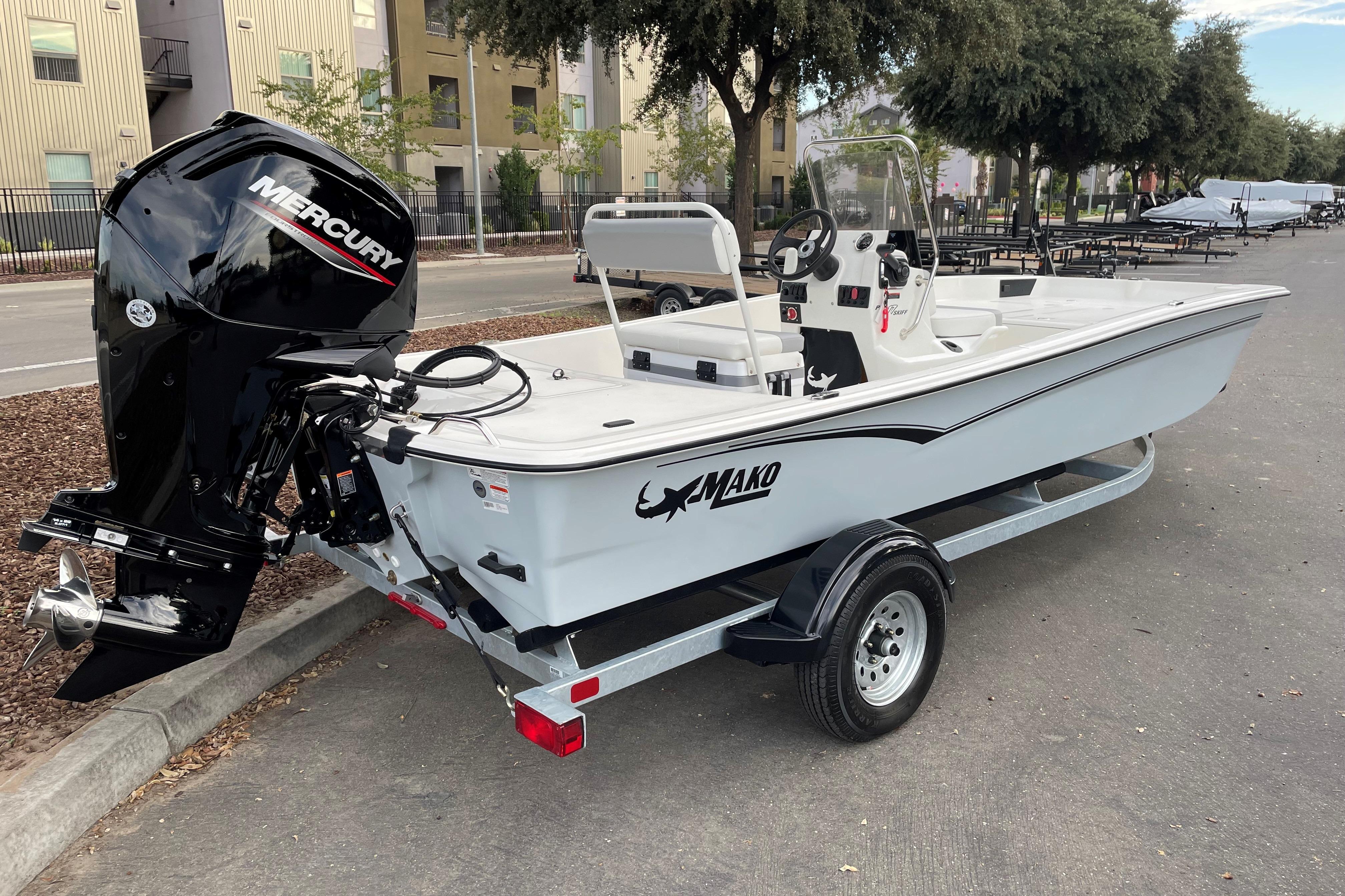 2025 Mako Pro Skiff 17 CC boat with Mercury engine on a trailer.