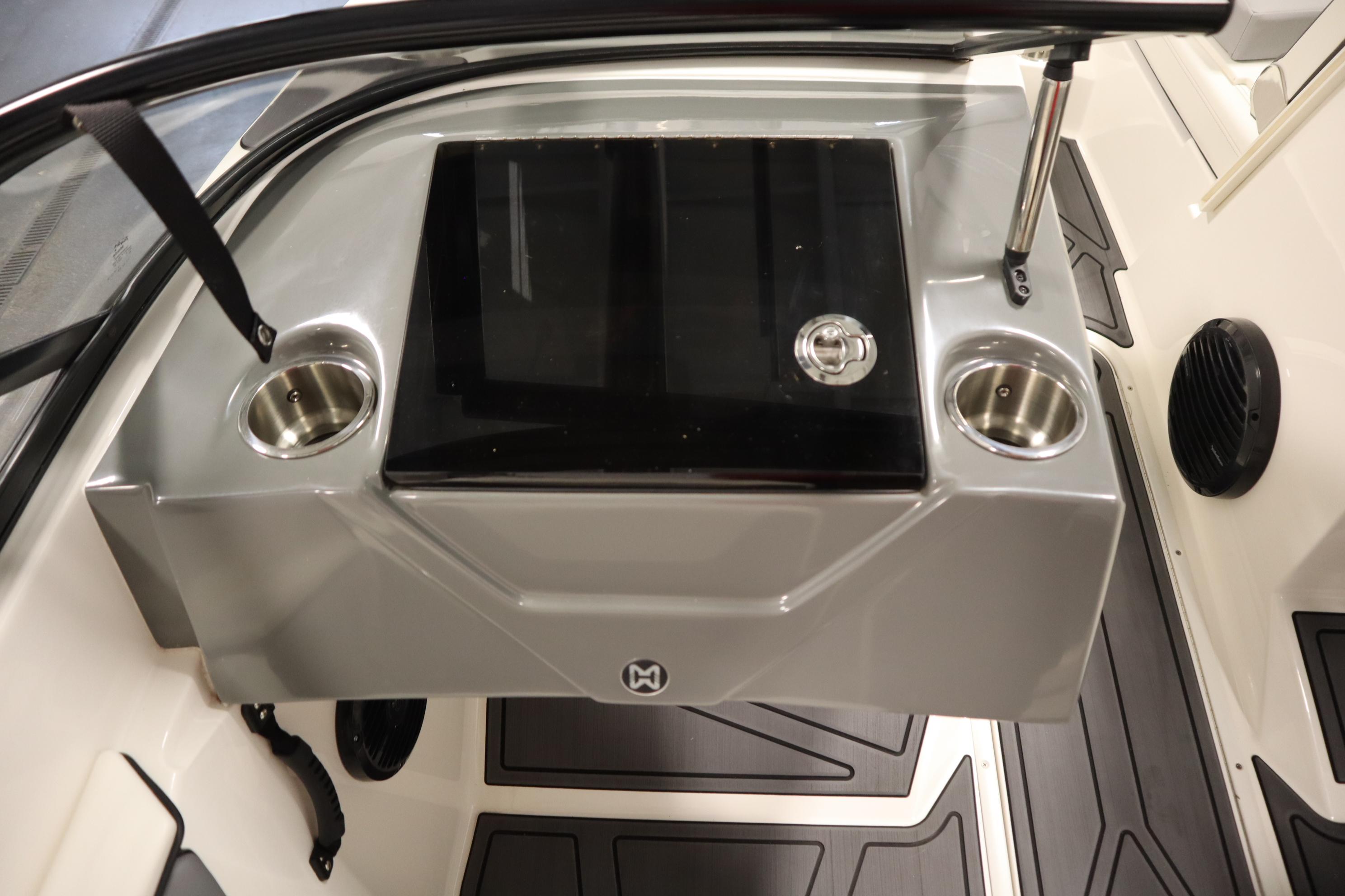 2023 Heyday WT Surf boat interior with cup holders and sleek design.