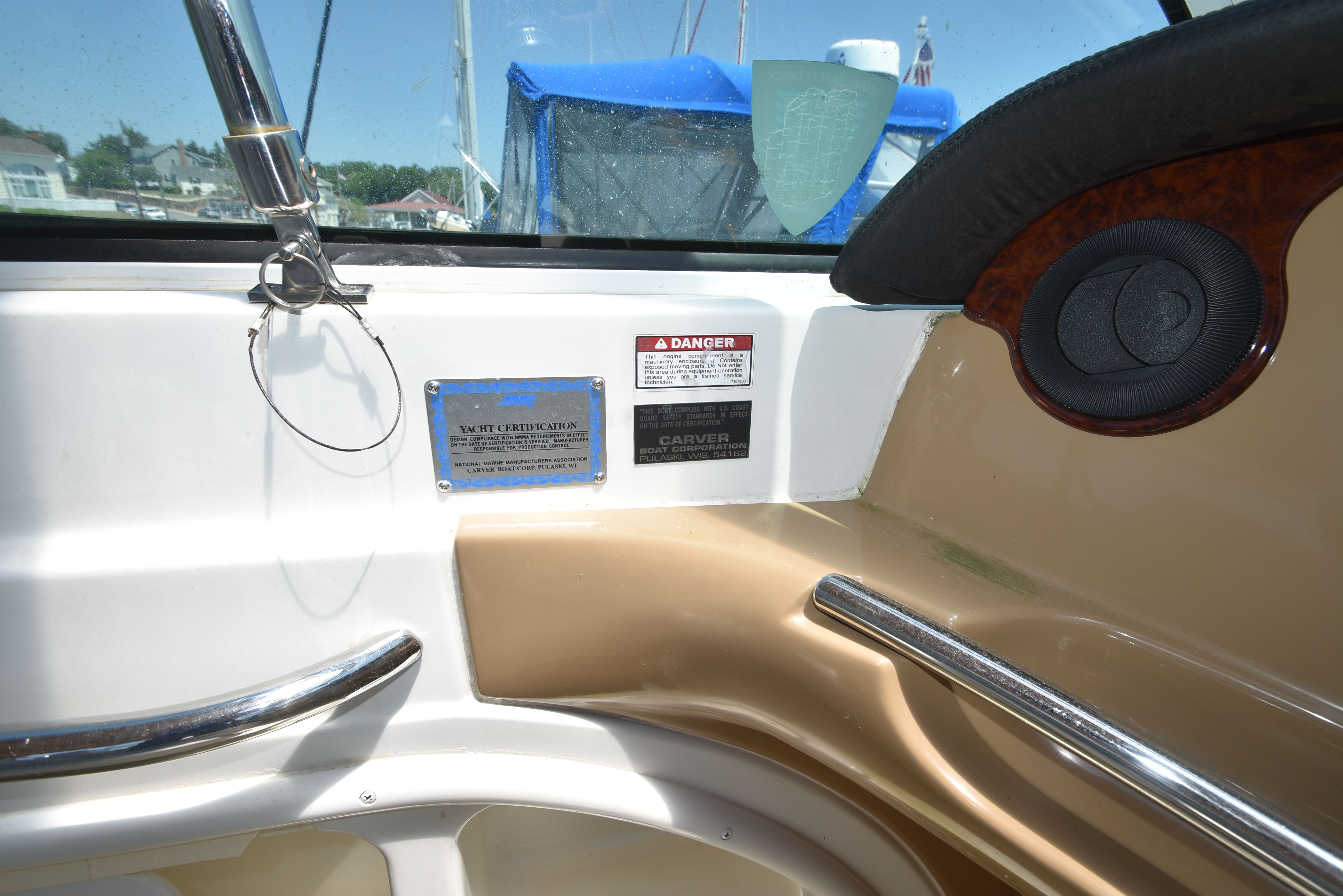 Interior view of a 2004 Carver 466 Motor Yacht with plaques and a speaker.