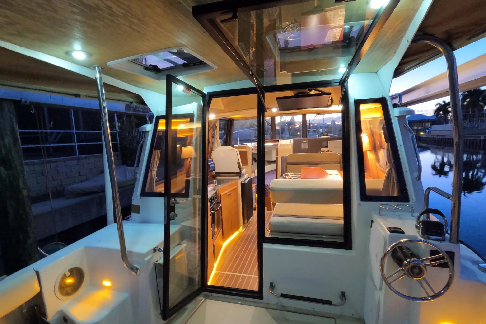 2015 Ranger Tugs R-29 S interior with ambient lighting and modern design.