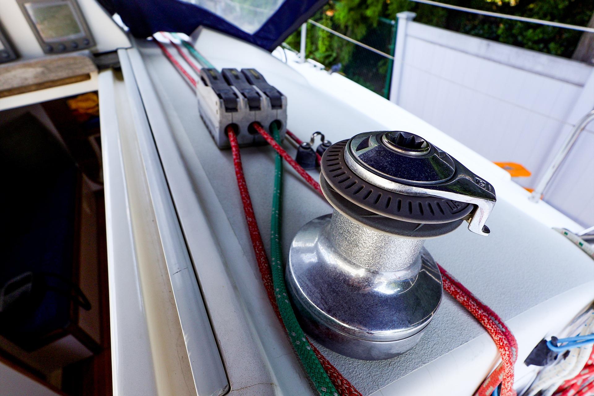 Winch and rope system on a 2001 J Boats J/32 sailboat deck.
