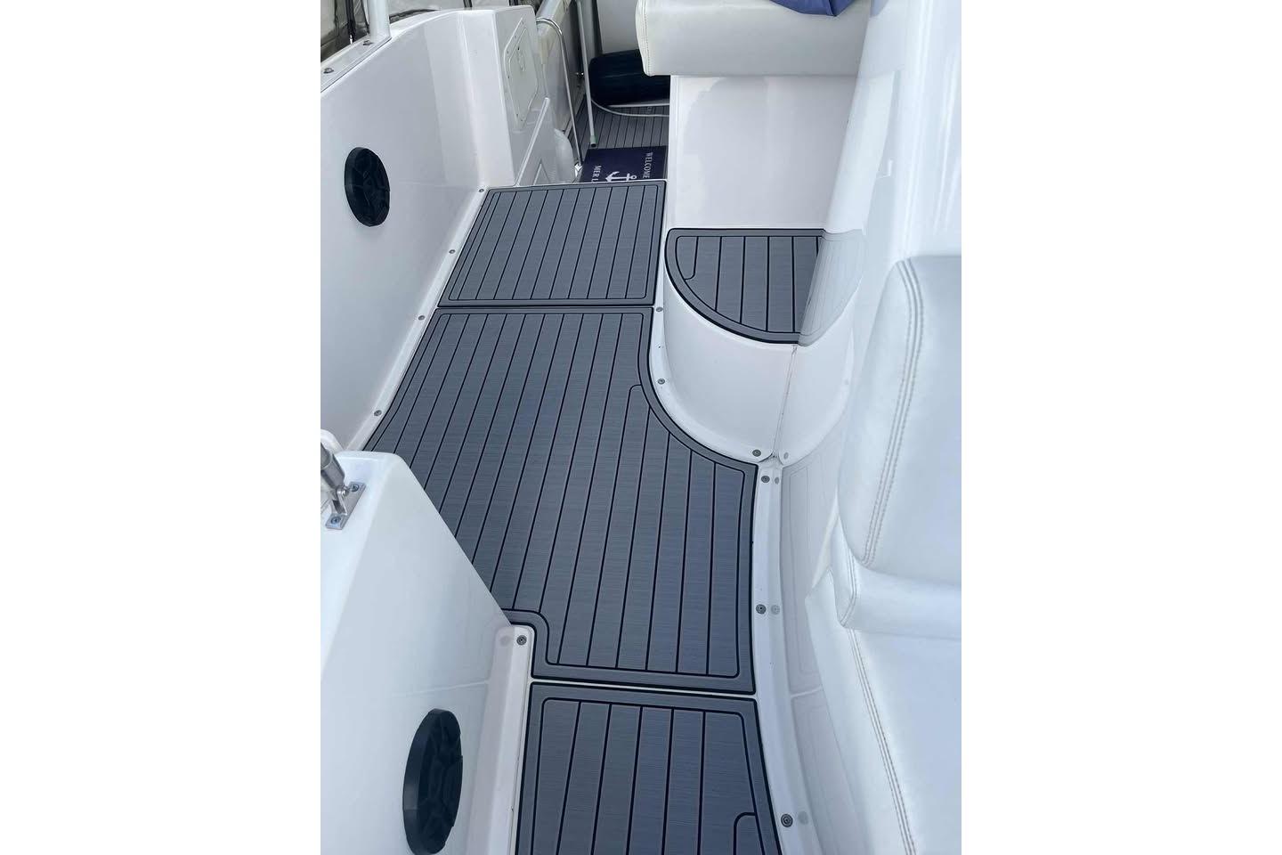 1999 Silverton 392 Motor Yacht deck with sleek, modern flooring and white seating.
