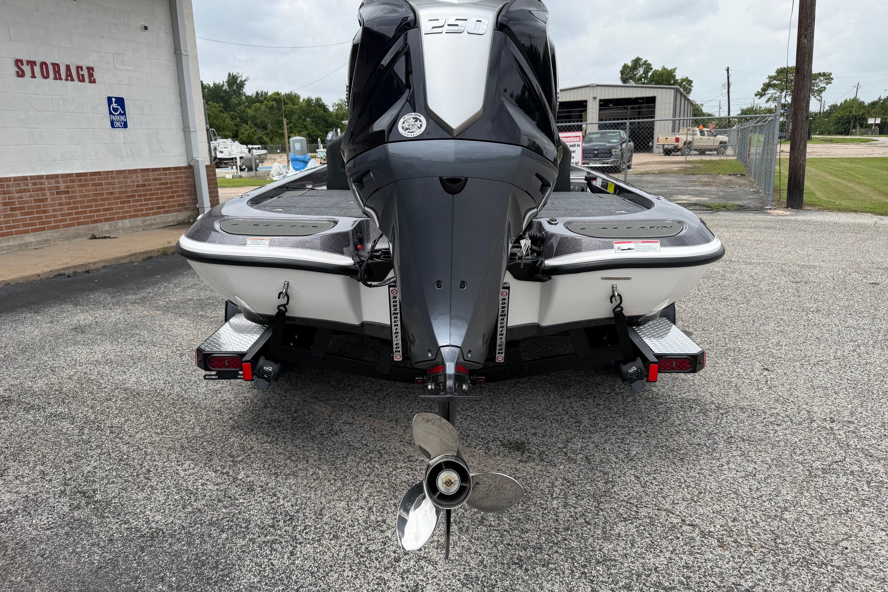 Rear view of a 2027 Falcon Boats F215 with powerful outboard motor.