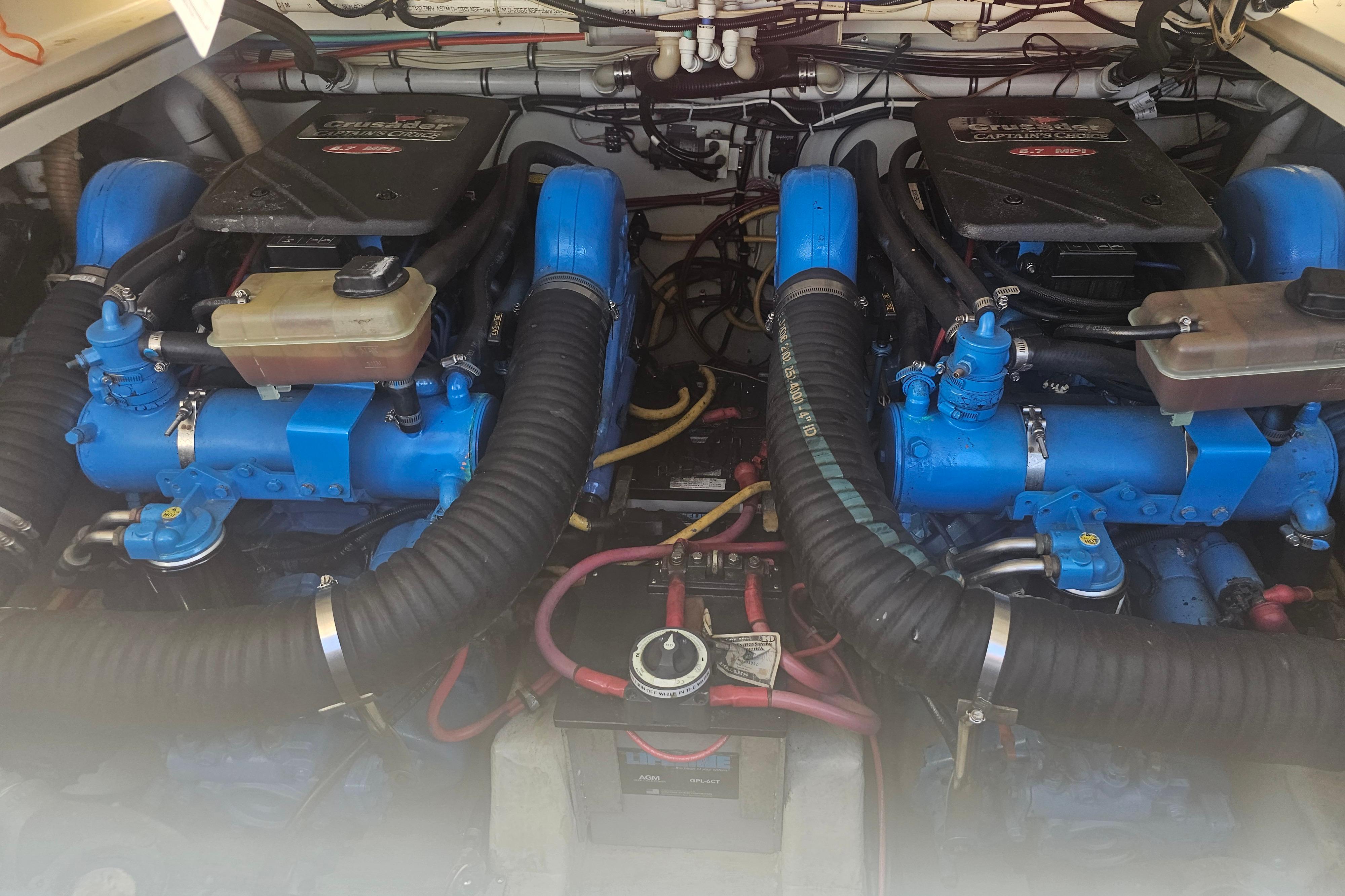 Twin Crusader engines in a 2001 Pursuit 3000 Express boat engine compartment.