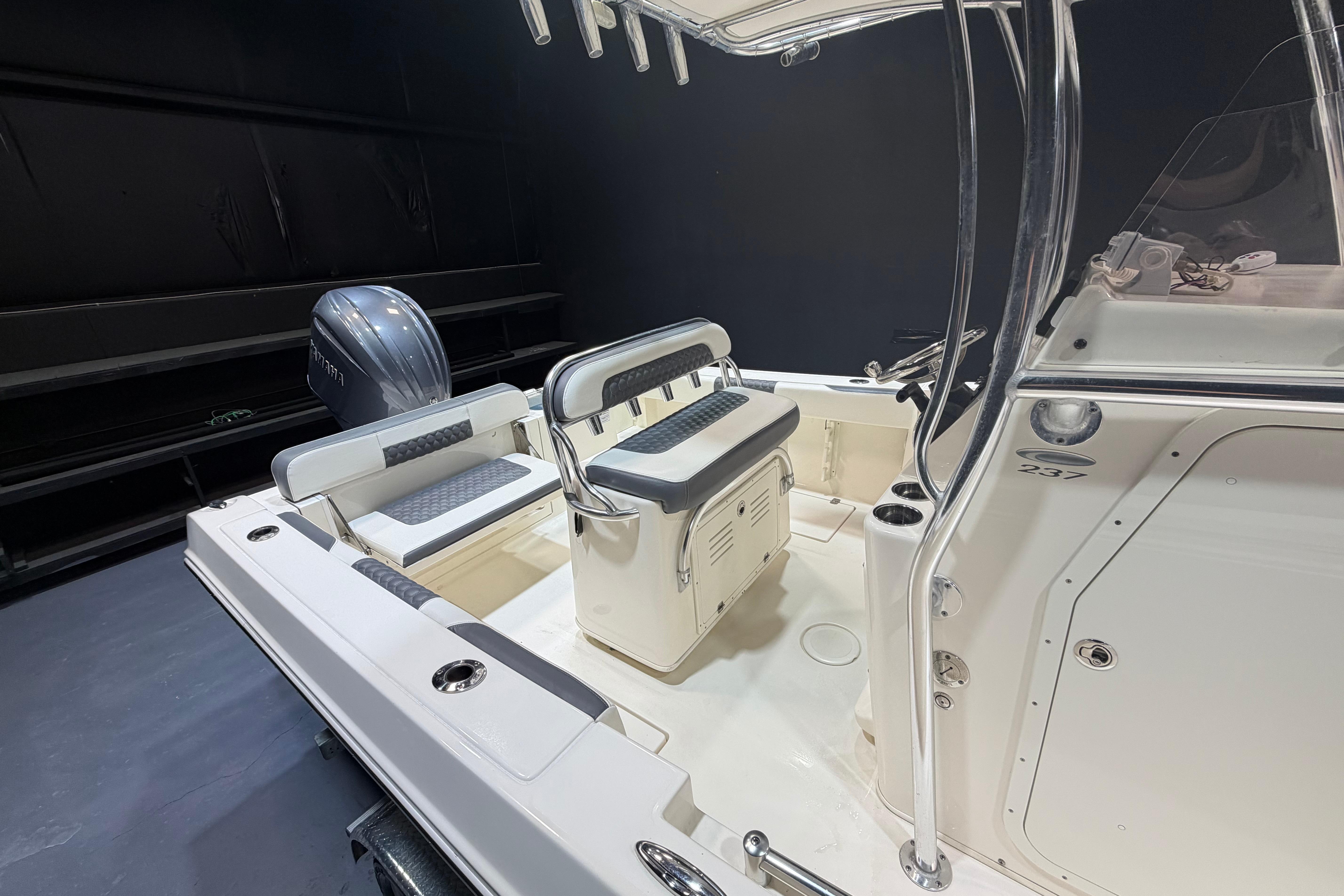 2023 Cobia 237 Center Console boat interior with seating and Yamaha outboard motor.