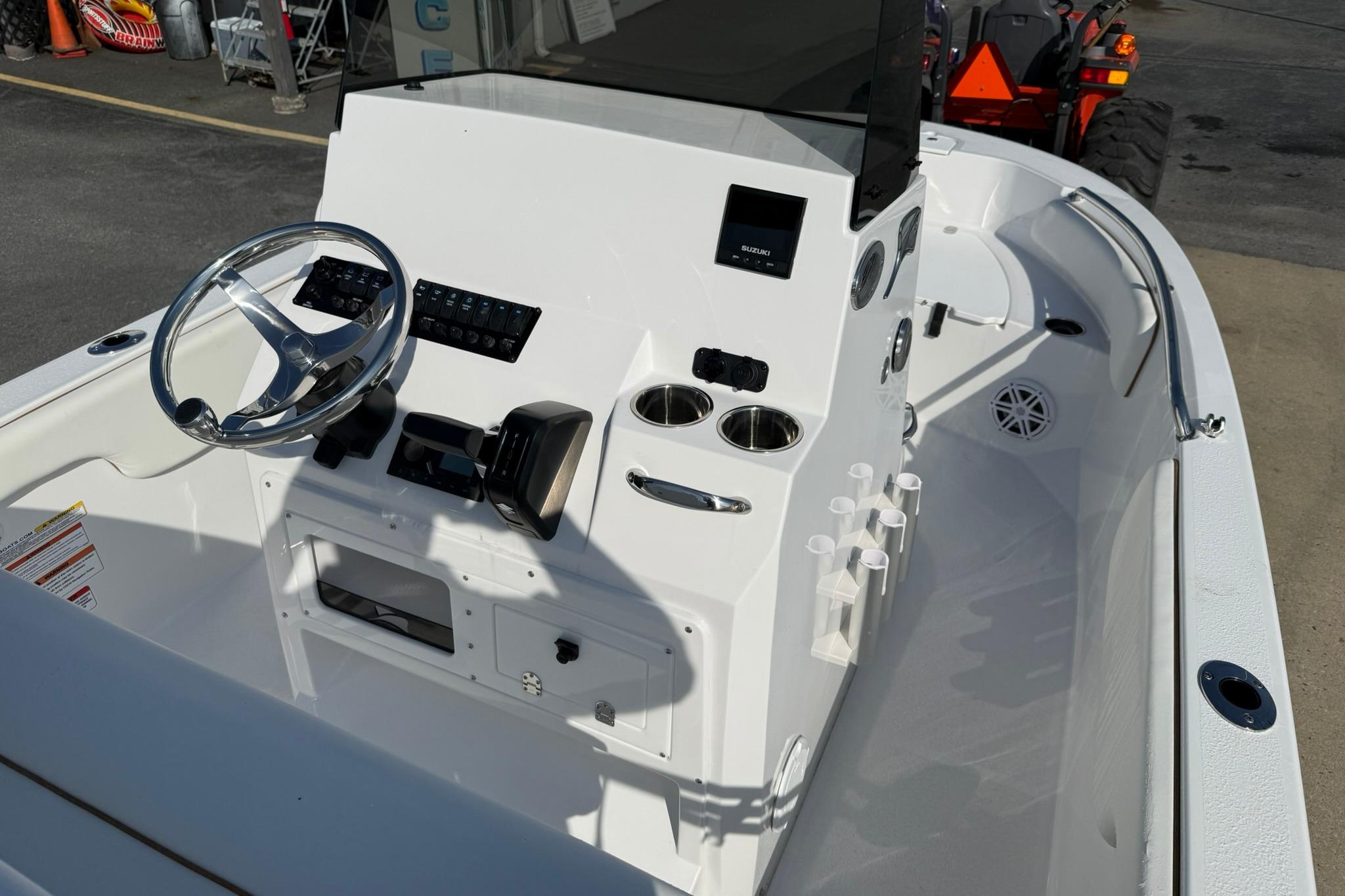 2026 Stingray 173 CC boat console with steering wheel and controls.