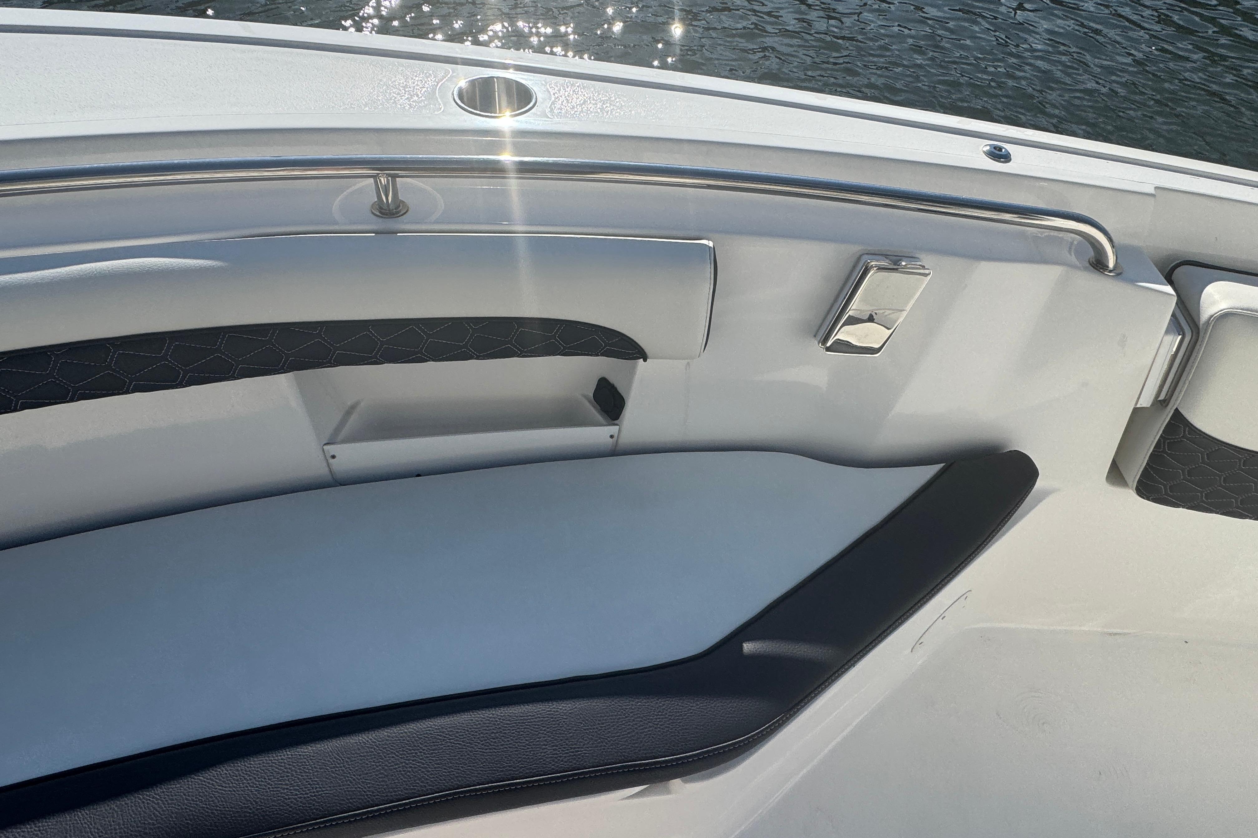 2025 Tidewater 232 LXF boat interior with sleek seating and stainless steel accents.