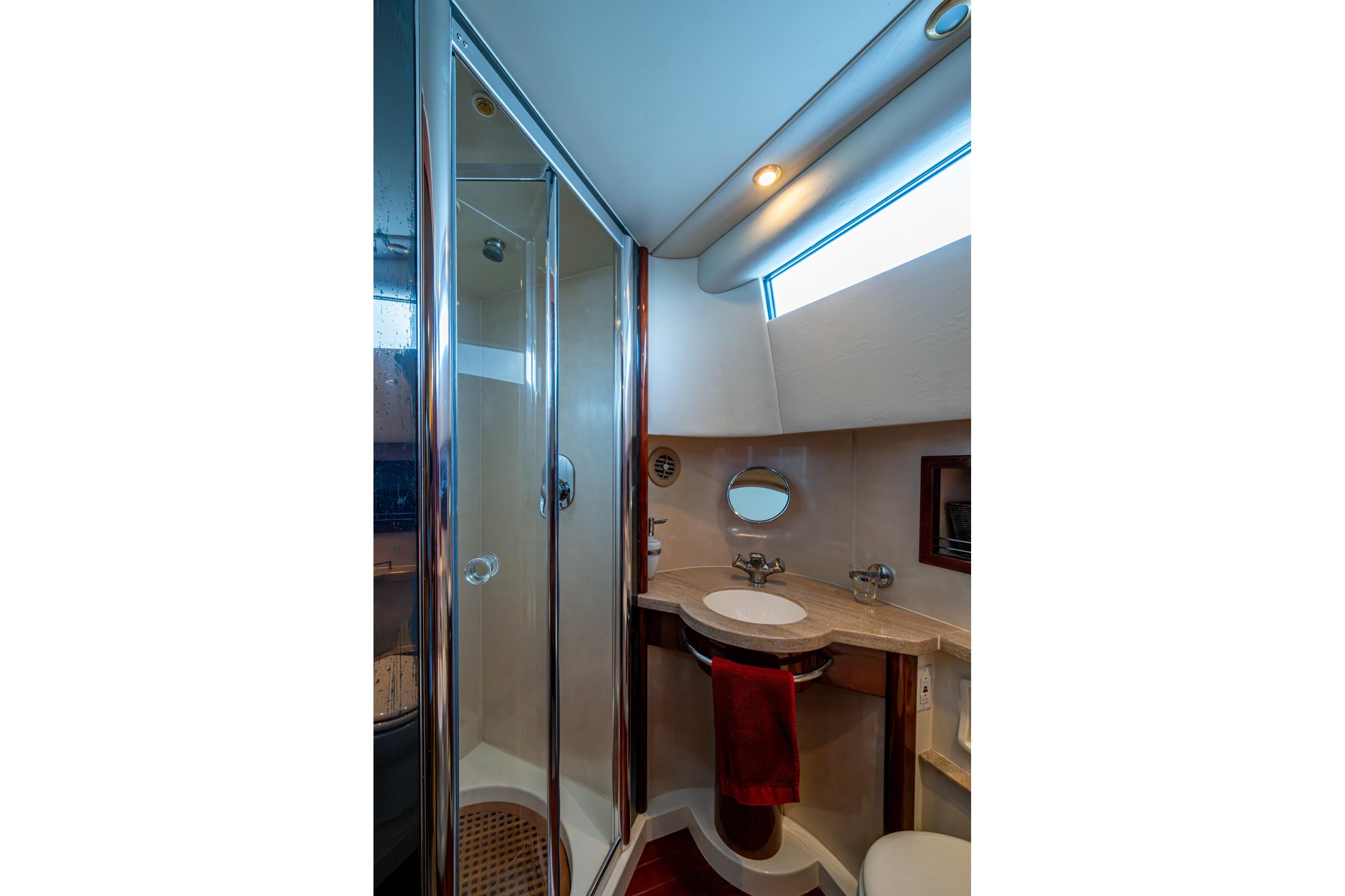 Luxurious bathroom in 2000 Fairline Squadron 52 yacht with shower and vanity.