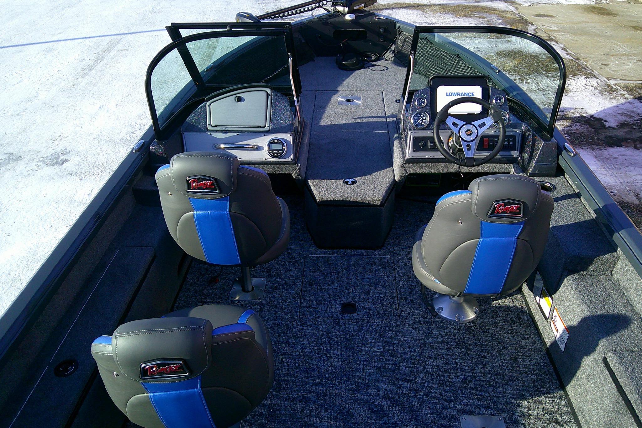 2026 Ranger VS1882SC Reata boat interior with blue-accented seats and modern dashboard.