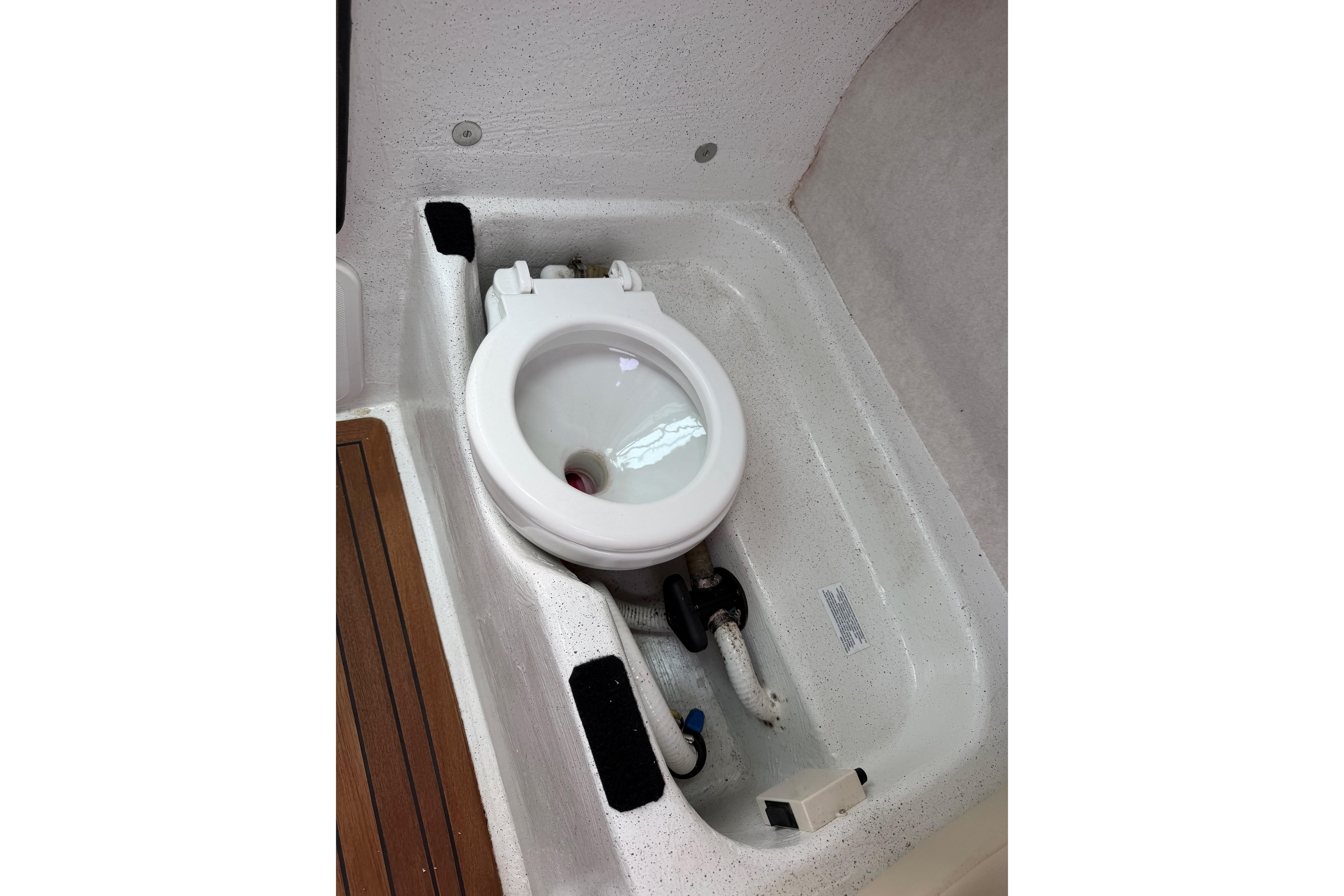 Boat toilet in a 2016 Protector Targa 30, featuring a compact and functional design.