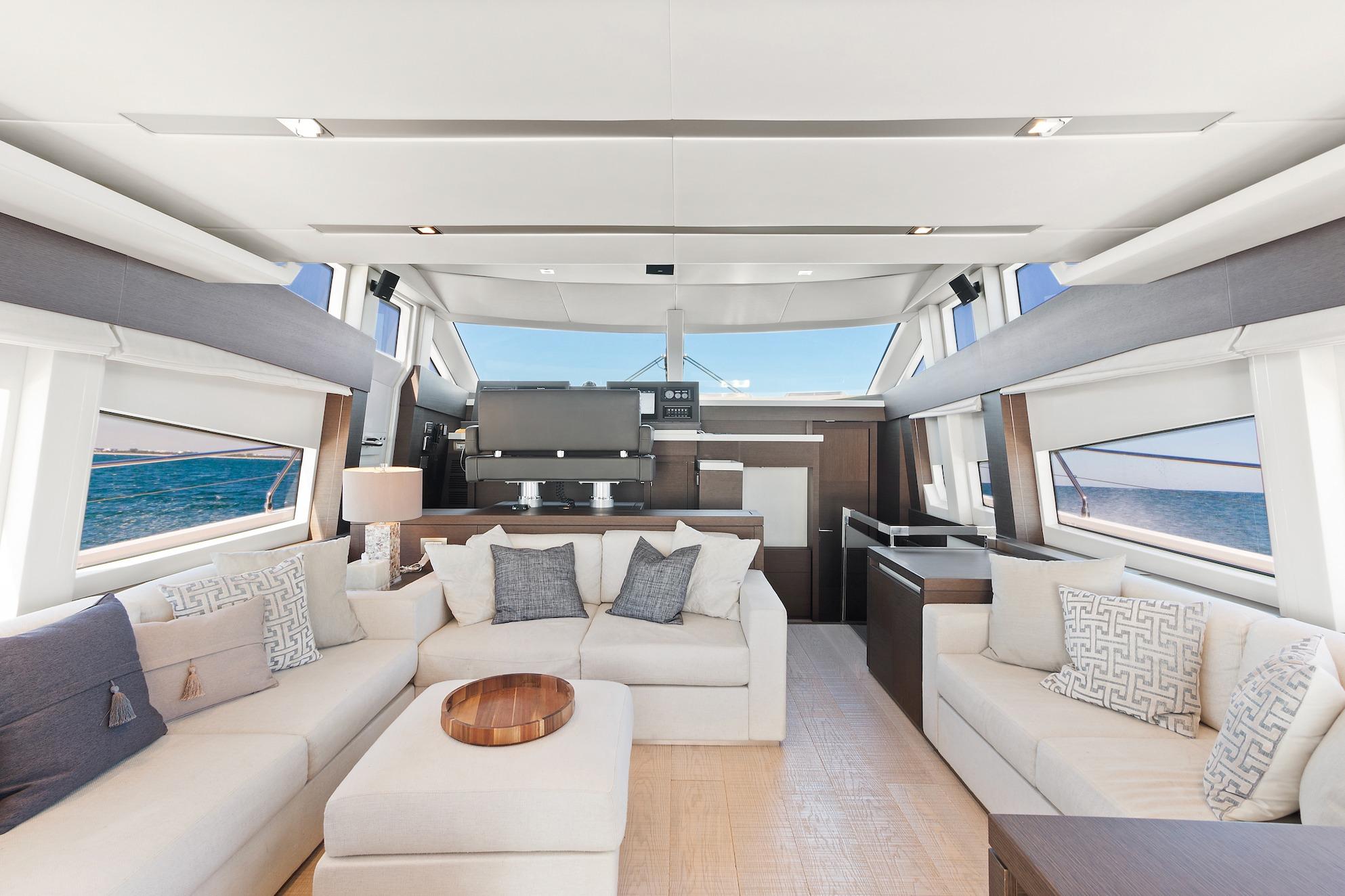 Luxurious interior of 2015 Prestige 750 yacht with elegant seating and ocean views.