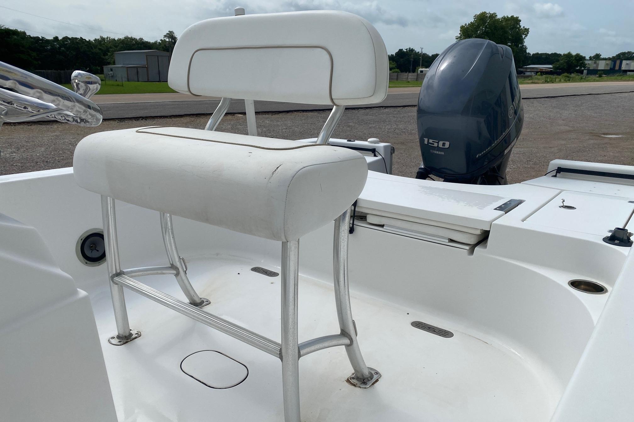 2013 Sportsman Masters 227 Bay Boat interior with seating and Yamaha 150 engine.