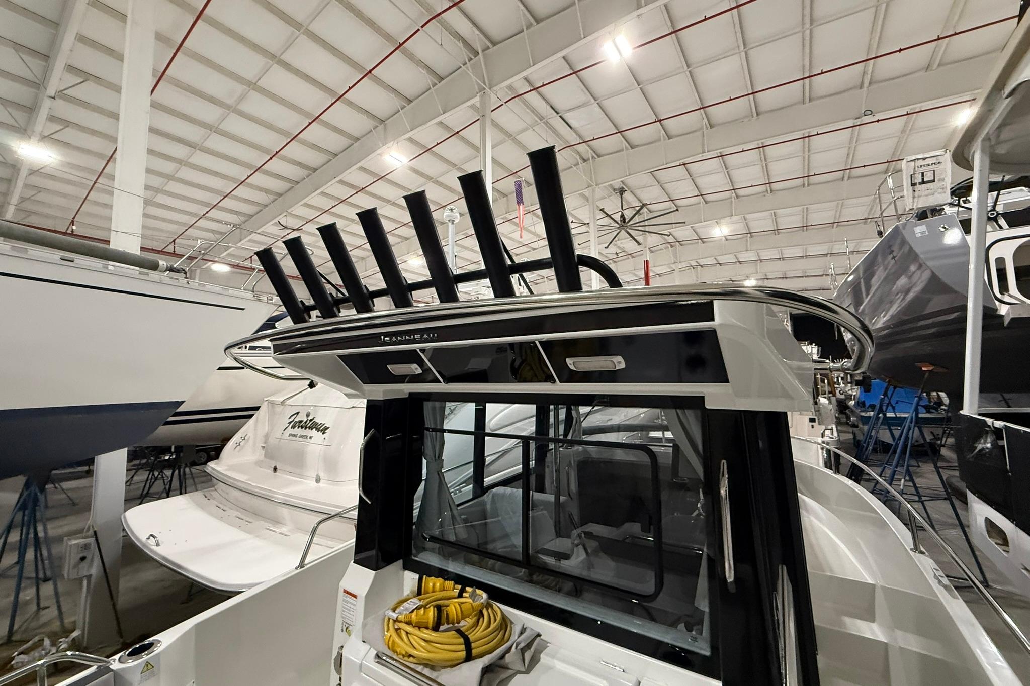 2024 Jeanneau NC Sport 795 Series 2 boat in indoor storage facility.