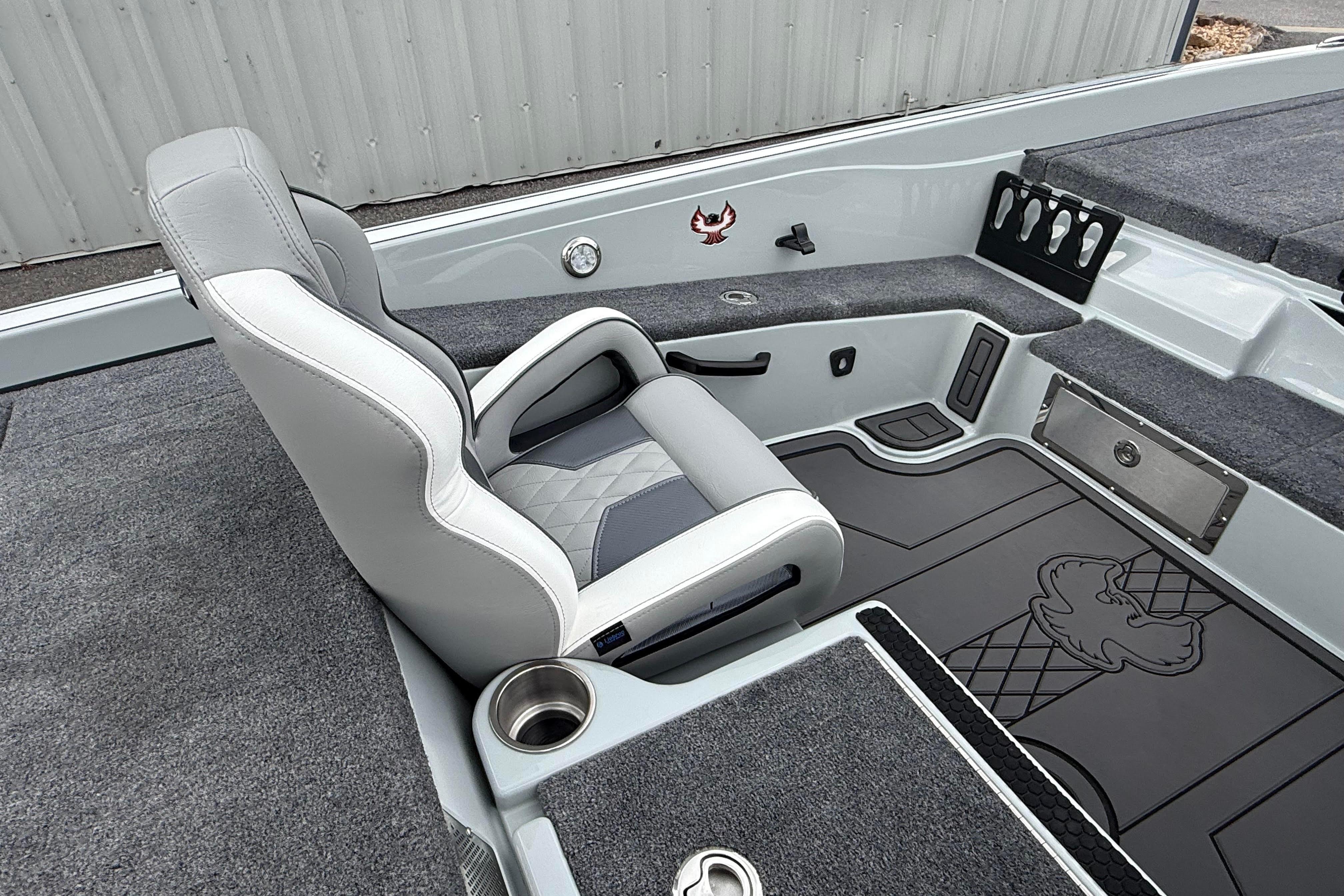 Luxurious interior of 2027 Phoenix 921 Elite X II boat with plush seating and sleek design.